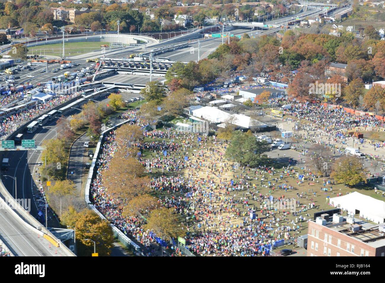 Members of Coast Guard Air Station Atlantic City fly over the Verrazano–Narrows Bridge, to provide aerial oversight during the 2016 New York City Marathon, Nov. 6, 2016. The Coast Guard worked with federal, state and local agencies to provide security during the event. Stock Photo