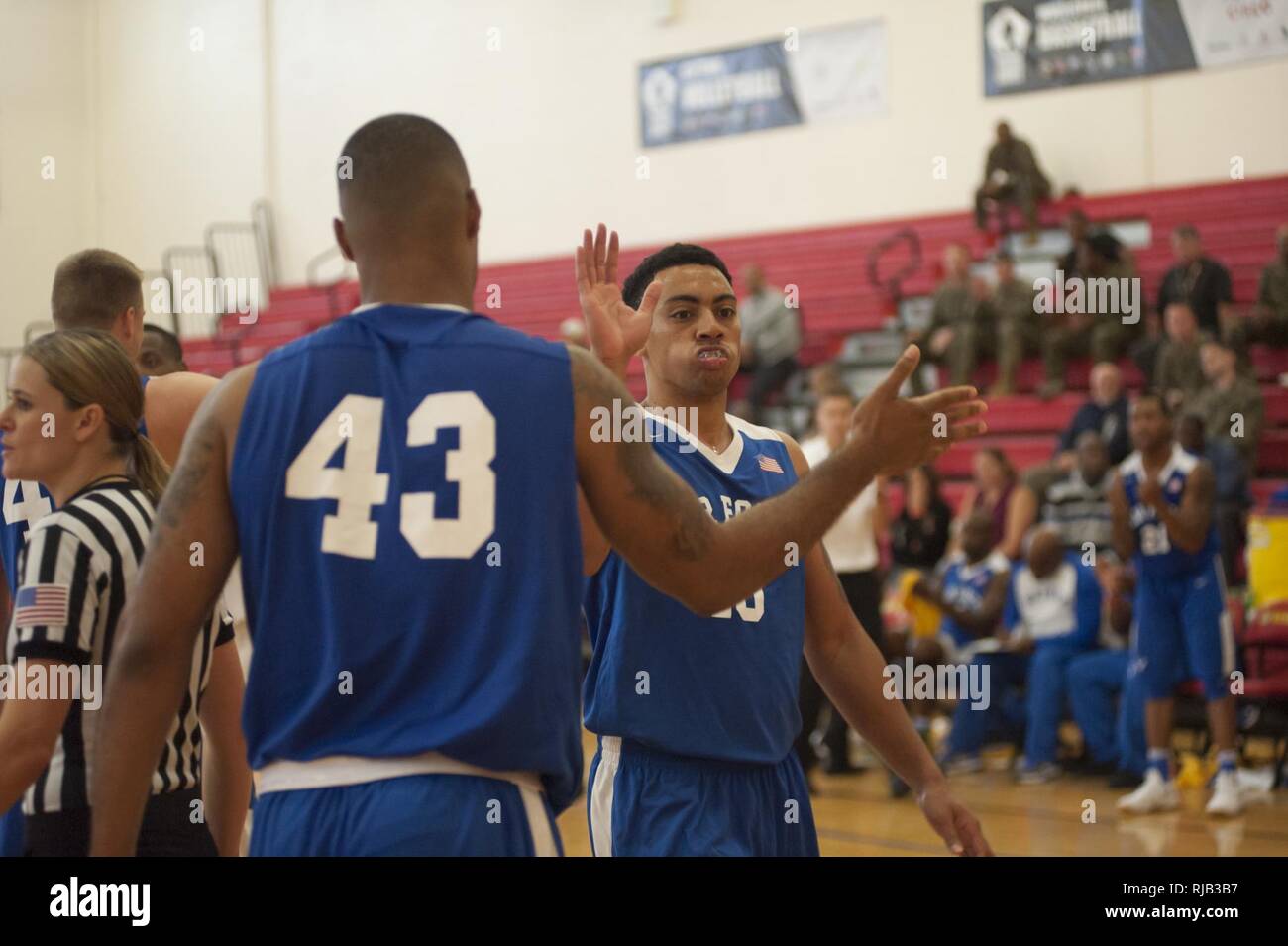 Members of the U.S. Air Force basketball team high five each other