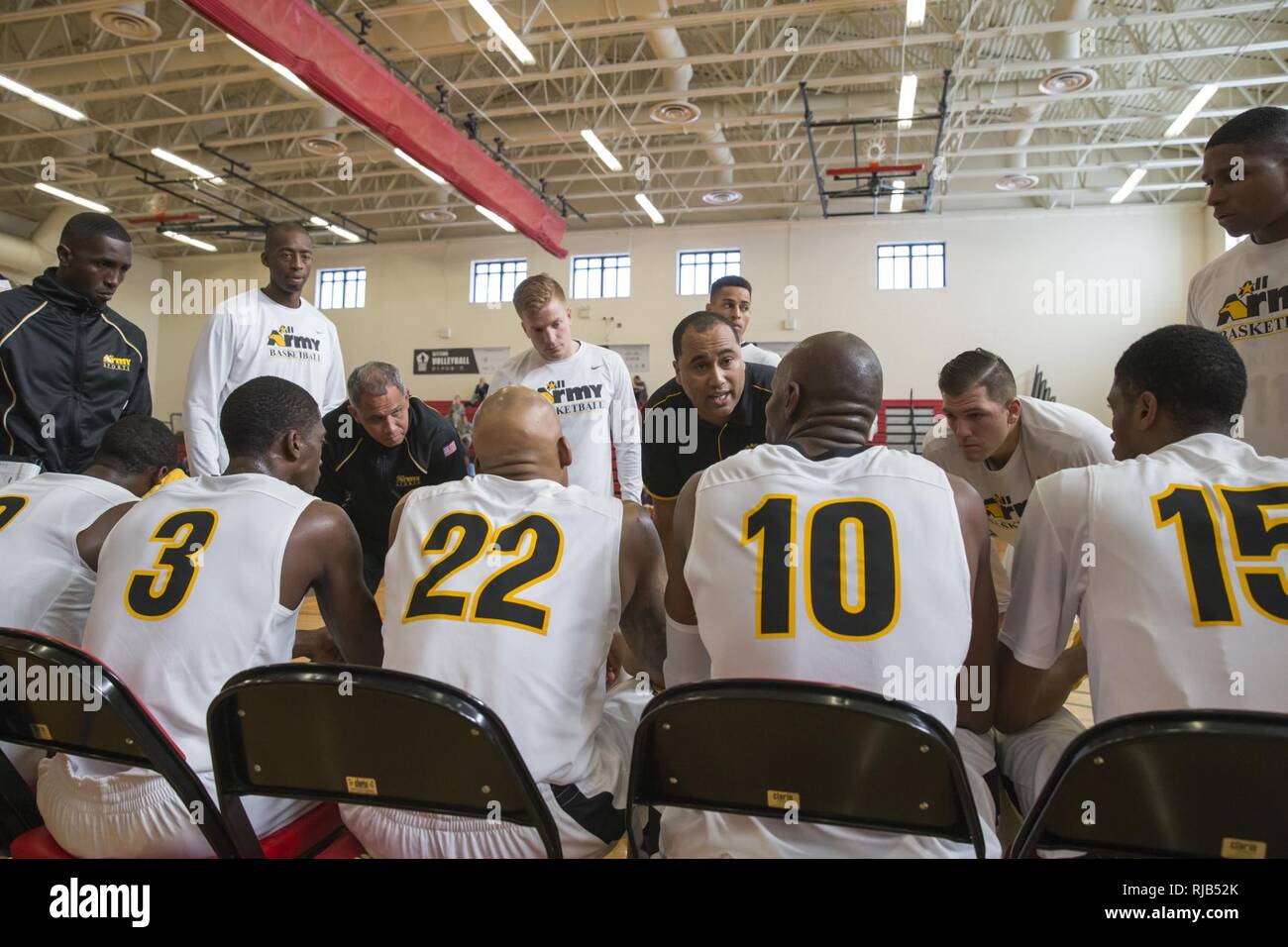 Coaches of the All Army basketball team give instruction during the
