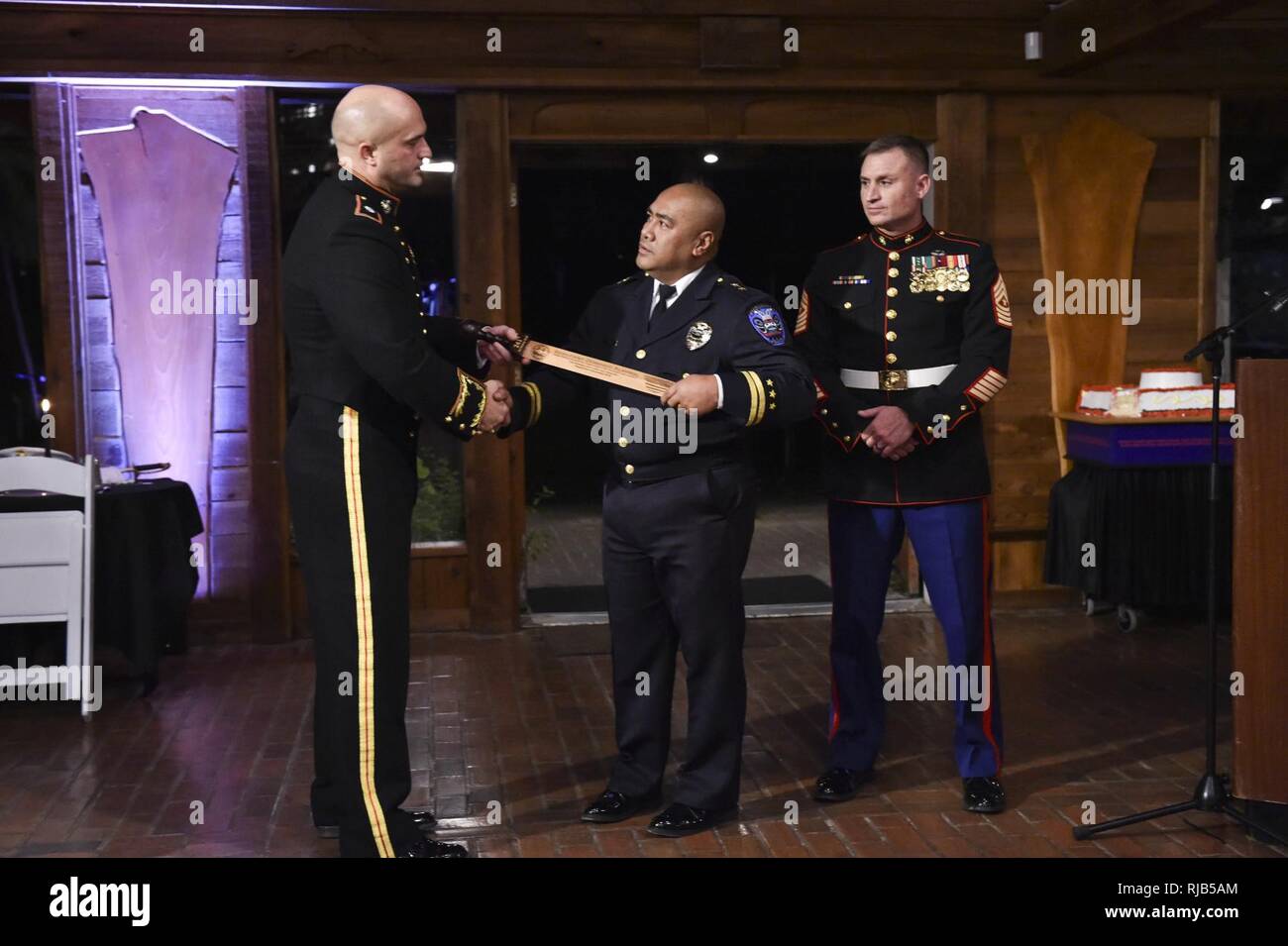 POULSBO, Wash. (Nov. 4, 2016) Marine Corps Security Force Battalion  (MCSFBn)-Bangor commanding officer Lt. Col. Scott Reed, a native of Olean,  New York, presents a rudis, traditionally given to gladiators who have