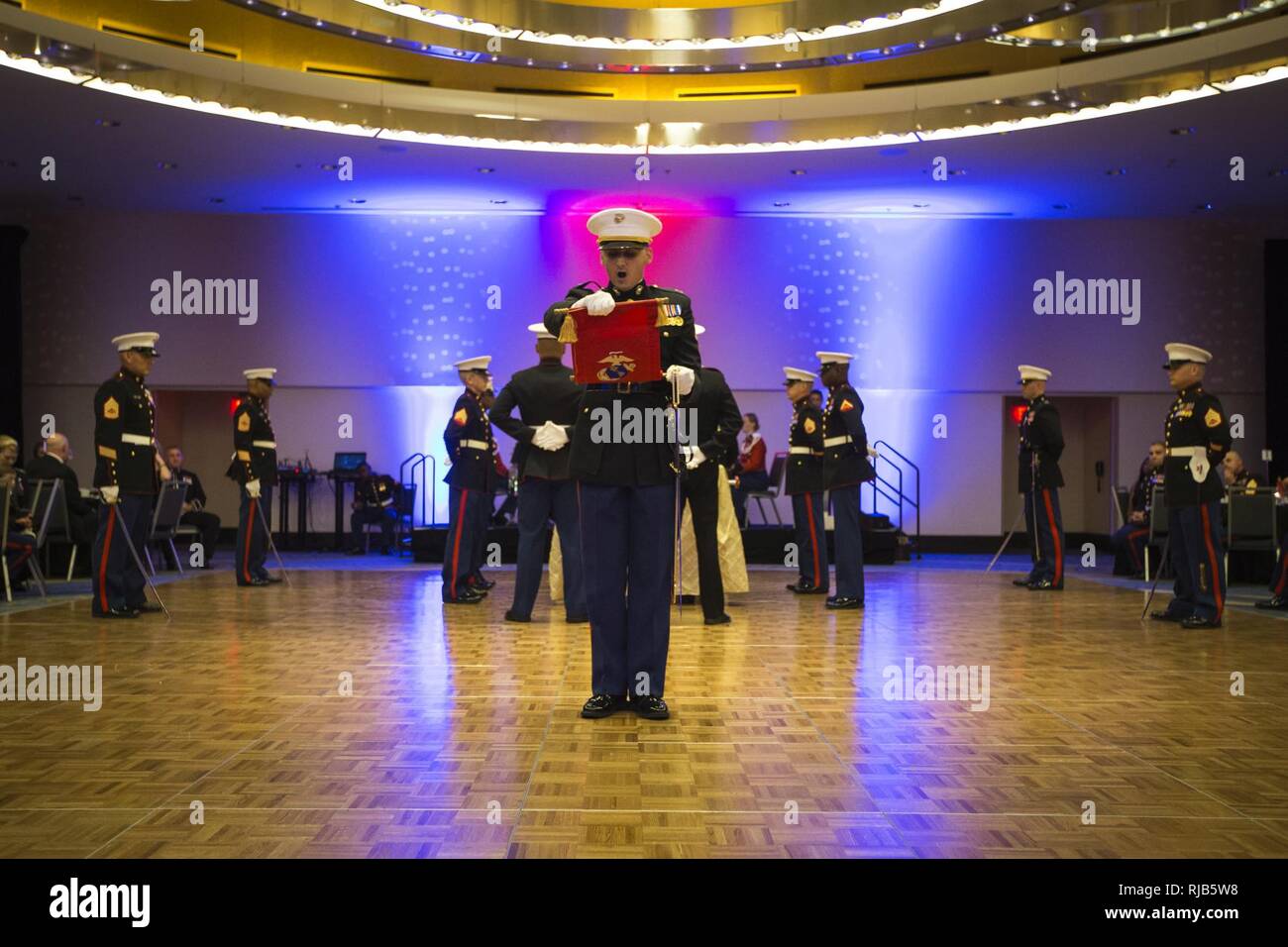 U.S. Marine Corps Capt. Vic E. Sanceda, adjutant, Headquarters & Service Battalion, Headquarters Marine Corps, reads off Gen. Lejeune’s message during a cake cutting ceremony at the Headquarters & Service Battalion Marine Corps Ball, Renaissance Arlington Capitol View Hotel, Arlington, Va., Nov. 05, 2016. The ball was held in celebration of the Marine Corps’ 241st birthday. Stock Photo