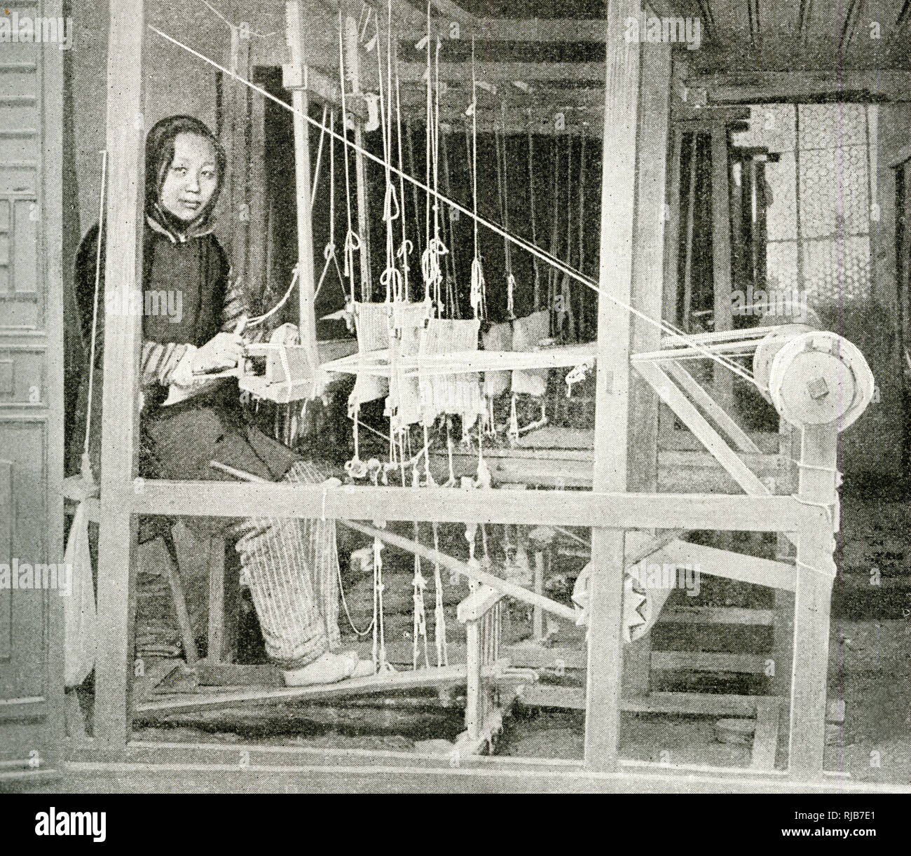 Young woman weaving on a loom, China, East Asia Stock Photo Alamy