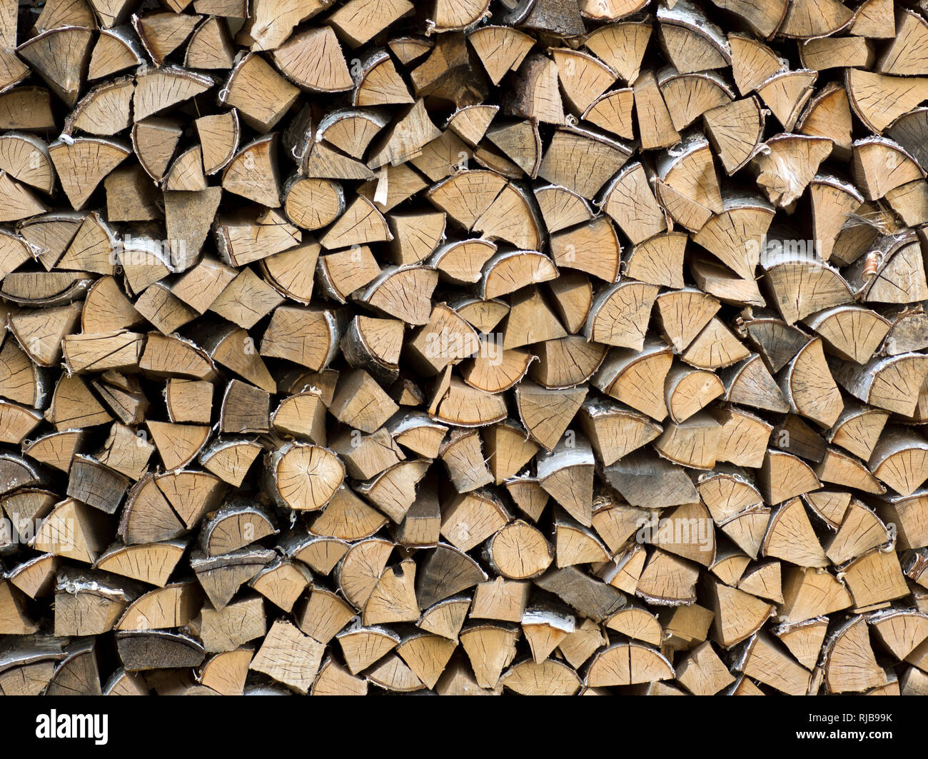 Birch firewood stacked. Firewood is any wooden material that is