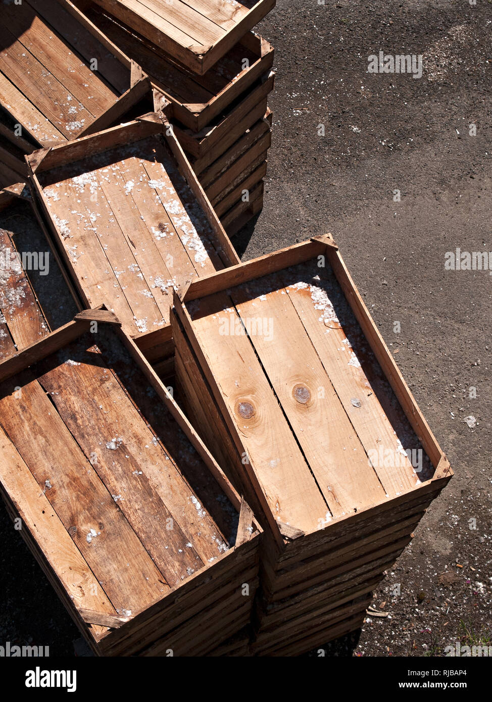 Fishing industry concept. Empty wooden fish crates stacked on pier. Top view Stock Photo
