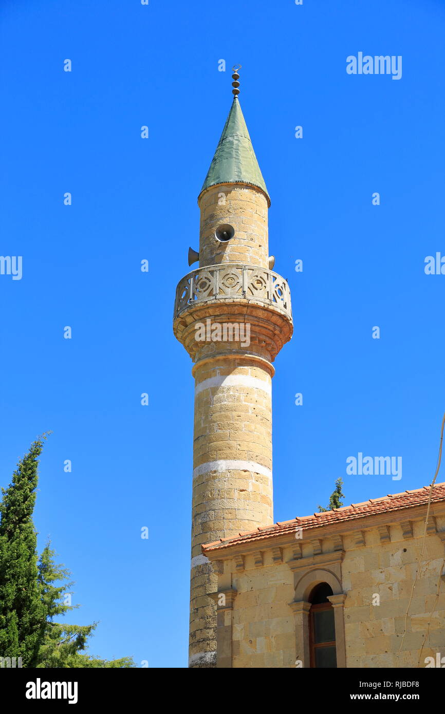 An ancient minaret in Anatolia. View of traditional and small old mosque. Stock Photo