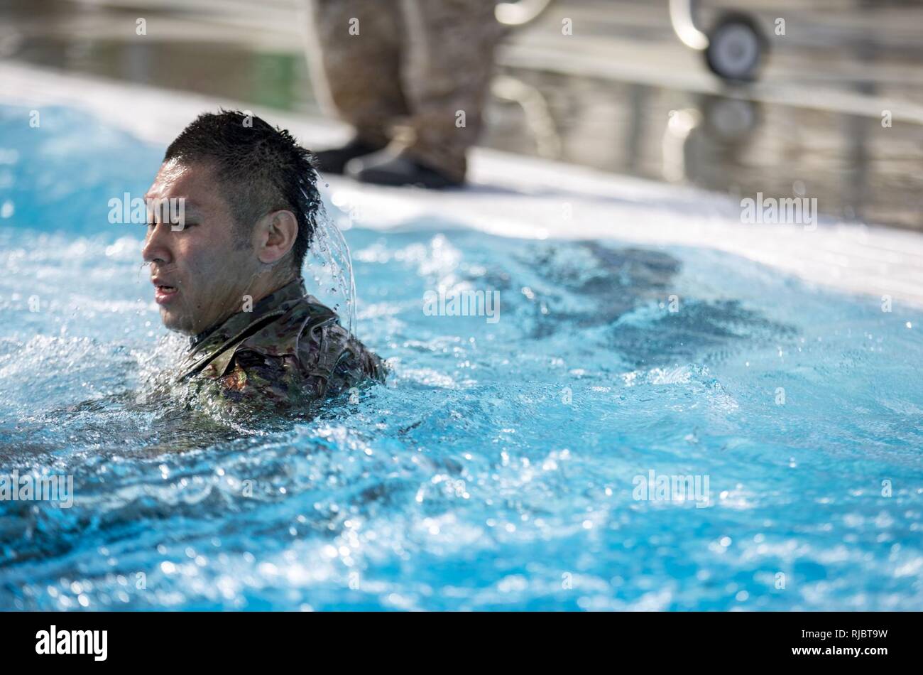 MARINE CORPS BASE CAMP PENDLETON, Calif. – A Japan Ground Self Defense Force Soldier participates in a Marine Corps intermediate swim qualification as part of exercise Iron Fist Jan. 16, 2018. Iron Fist brings together U.S. Marines from the 11th Marine Expeditionary Unit and Soldiers from the Japan Ground Self Defense Force, Western Army Infantry Regiment, to improve bilateral planning, communicating, and conduct combined amphibious operations. Stock Photo