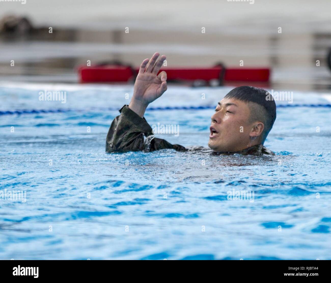 MARINE CORPS BASE CAMP PENDLETON, Calif. – A Japan Ground Self Defense Force soldier participates in a Marine Corps intermediate swim qualification as part of exercise Iron Fist Jan. 16, 2018. Iron Fist brings together U.S. Marines from the 11th Marine Expeditionary Unit and Soldiers from the Japan Ground Self Defense Force, Western Army Infantry Regiment, to improve bilateral planning, communicating, and conduct combined amphibious operations. Stock Photo