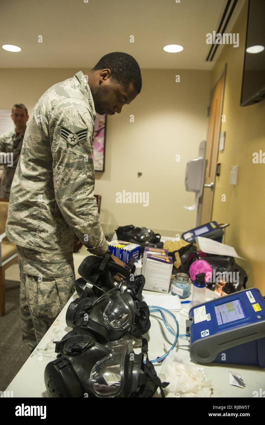 U.S. Air Force Senior Airman Brandon Burgess, 20th Aerospace Medicine Squadron bioenvironmental journeyman, prepares gas masks for fit testing at Shaw Air Force Base, S.C., Jan. 12, 2018. The bioenvironmental engineering flight does a gas mask fit test for Airmen on the installation to prepare them for deployments. Stock Photo