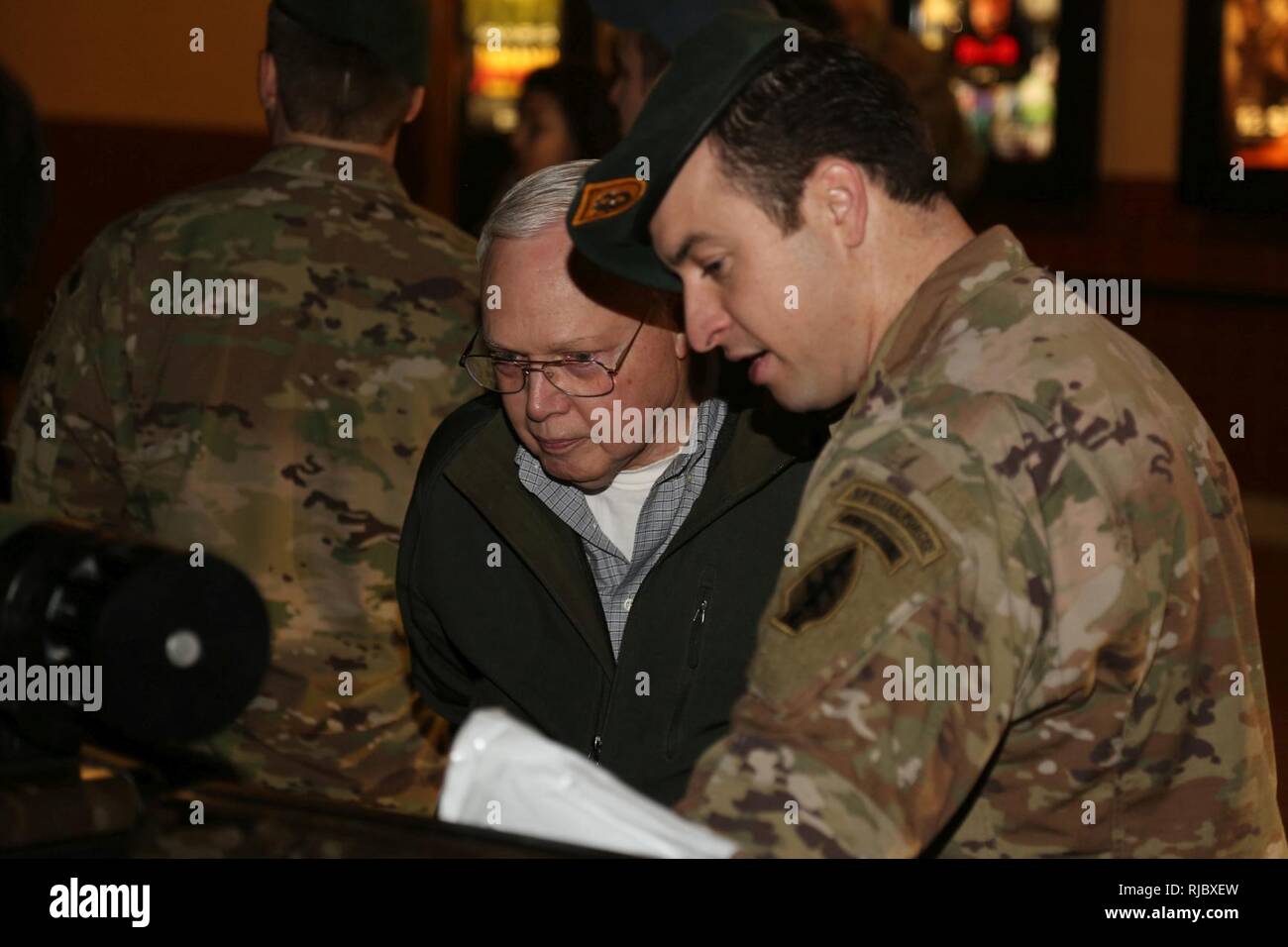 A 1st Special Forces Group (Airborne) Green Beret explains the technical  aspect of medical equipment, Jan. 13, to patrons coming to see the special  showing of the movie 12 Strong: The Declassified