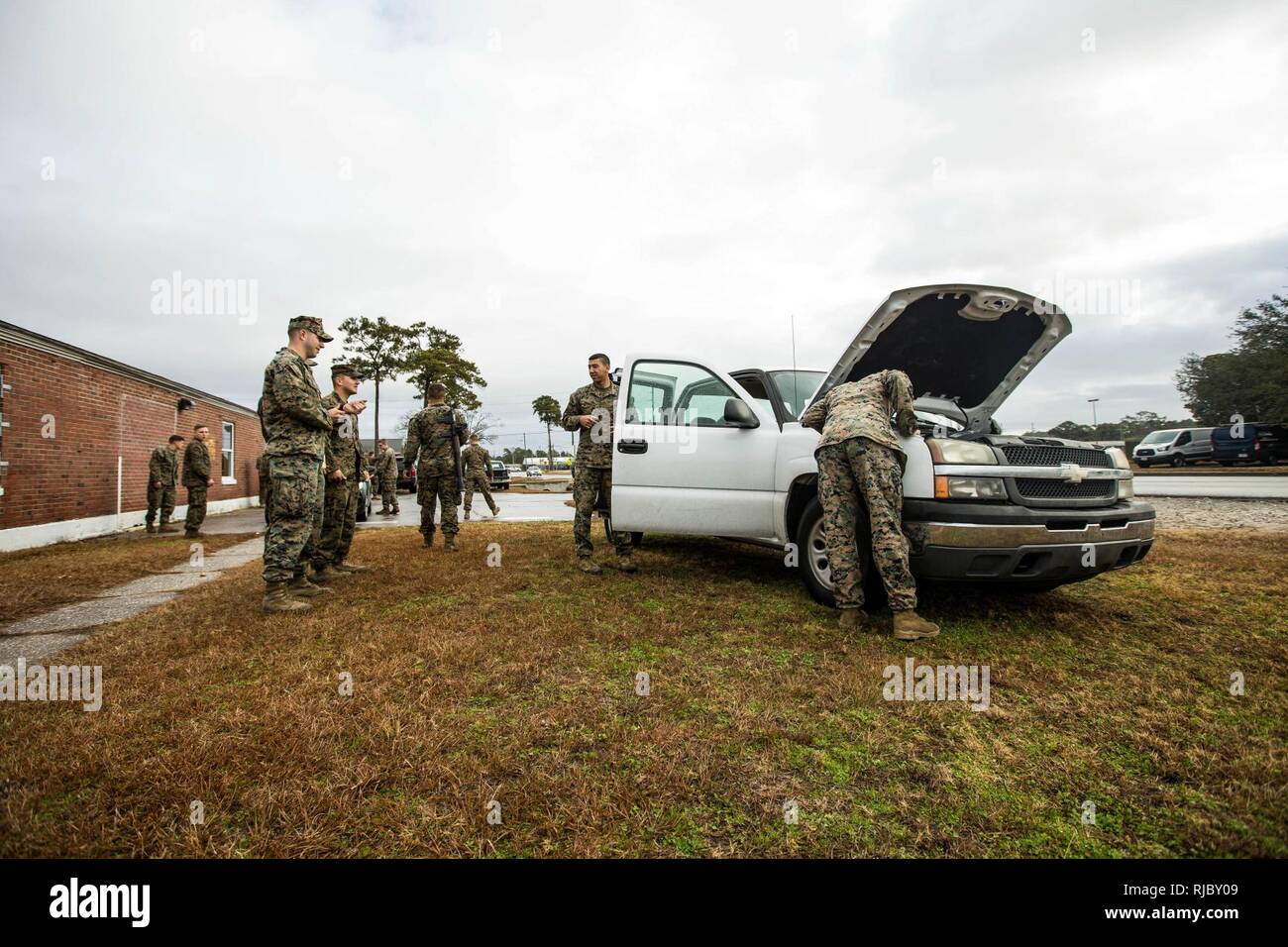 U.S. Marines and with Battalion Landing Team, 2nd Battalion, 6th Marine Regiment, 26th Marine Expeditionary Unit (MEU), participate in vehicle-borne improvised explosive device (VBIED) training on Camp Lejeune, N.C., Jan. 11, 2018. The two-day course was held to educate Marines on the proper procedures of inspecting vehicles and civilians for potential threats while also giving them the opportunity to practice techniques in preparation for the upcoming deployment. Stock Photo