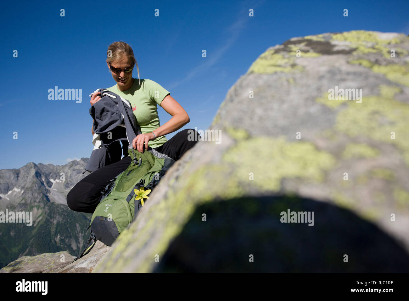 Young woman hiking at the Aschaffenburger HÃ¶henweg, Zillertal Alps, Tyrol, Austria Stock Photo