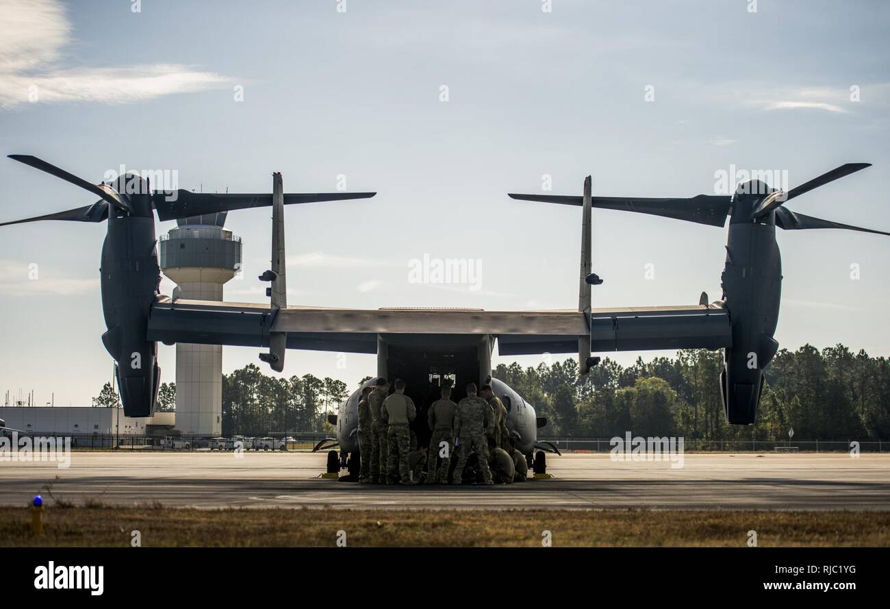 A U.S. Air Force CV-22 Osprey aircrew with the 8th Special Operations Squadron receive a pre-mission brief at the Gulfport Combat Readiness Training Center, Miss., during Southern Strike 17, Nov. 2, 2016. Southern Strike 17 is a total force, multi-service training exercise hosted by the Mississippi Air National Guard’s Combat Readiness Training Center in Gulfport, Miss., from Oct. 24 through Nov. 4, 2016. The exercise emphasizes air-to-air, air-to-ground and special operations forces training opportunities. These events are integrated into demanding hostile and asymmetric scenarios with action Stock Photo