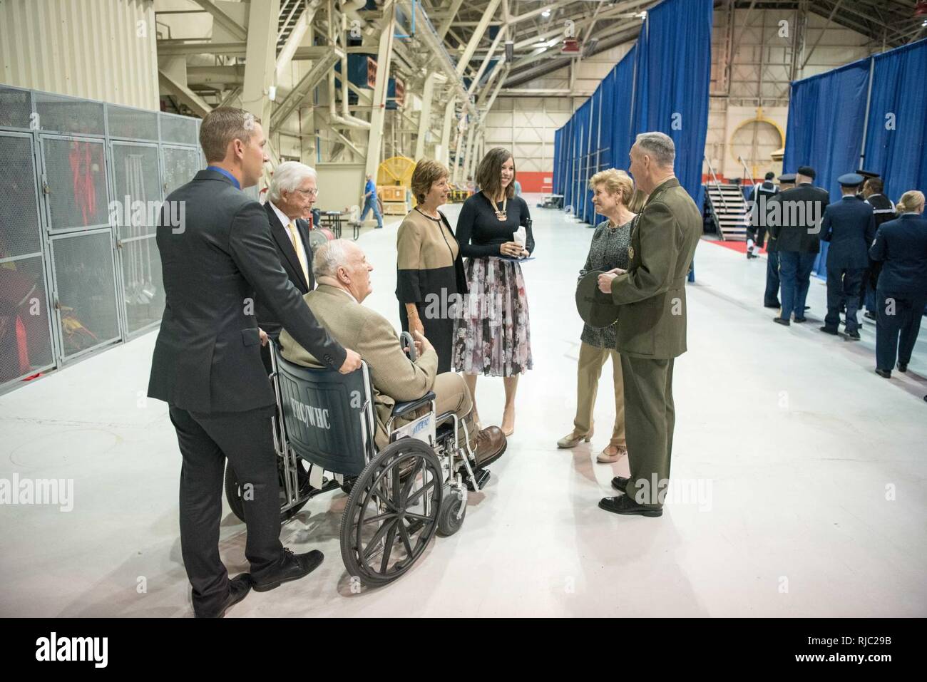 Marine Gen. Joseph F. Dunford Jr., chairman of the Joint Chiefs of Staff, meets with the family of Air Force Gen. John E. Hyten following the Strategic Command change of command ceremony at Offutt Air Force Base, Omaha, Nebraska Nov. 3, 2016.  Air Force Gen. John E. Hyten assumes command from Navy Adm. Cecil D. Haney. Stock Photo