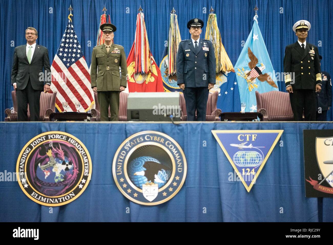 Defense Secretary Ash Carte and Marine Gen. Joseph F. Dunford Jr., chairman of the Joint Chiefs of Staff, participate in the Strategic Command change of command ceremony at Offutt Air Force Base, Omaha, Nebraska Nov. 3, 2016.  Air Force Gen. John E. Hyten assumes command from Navy Adm. Cecil D. Haney. Stock Photo