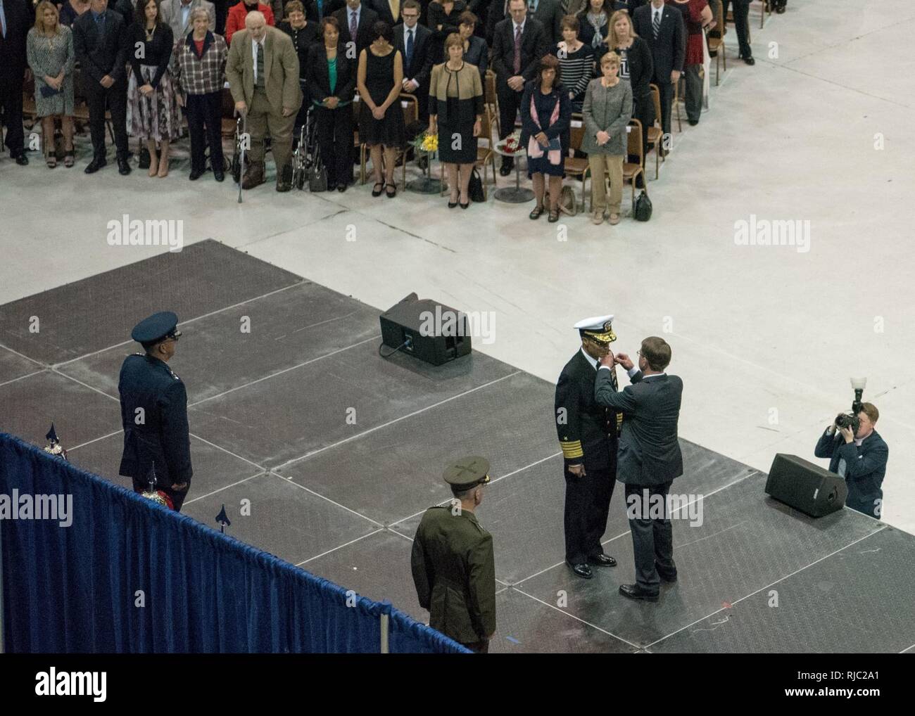 Defense Secretary Ash Carter, Marine Gen. Joseph F. Dunford Jr., chairman of the Joint Chiefs of Staff, delivers remarks during the Strategic Command change of command ceremony at Offutt Air Force Base, Omaha, Nebraska Nov. 3, 2016.  Air Force Gen. John E. Hyten assumes command from Navy Adm. Cecil D. Haney. Stock Photo