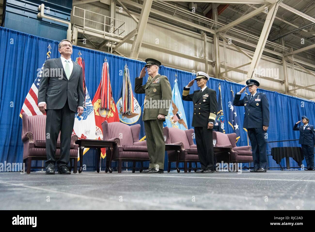 Defense Secretary Ash Carter, Marine Gen. Joseph F. Dunford Jr., chairman of the Joint Chiefs of Staff, Air Force Gen. John E. Hyten, and Navy Adm. Cecil D. Haney participate in the Strategic Command change of command ceremony at Offutt Air Force Base, Omaha, Nebraska Nov. 3, 2016.  Air Force Gen. John E. Hyten assumes command from Navy Adm. Cecil D. Haney. Stock Photo