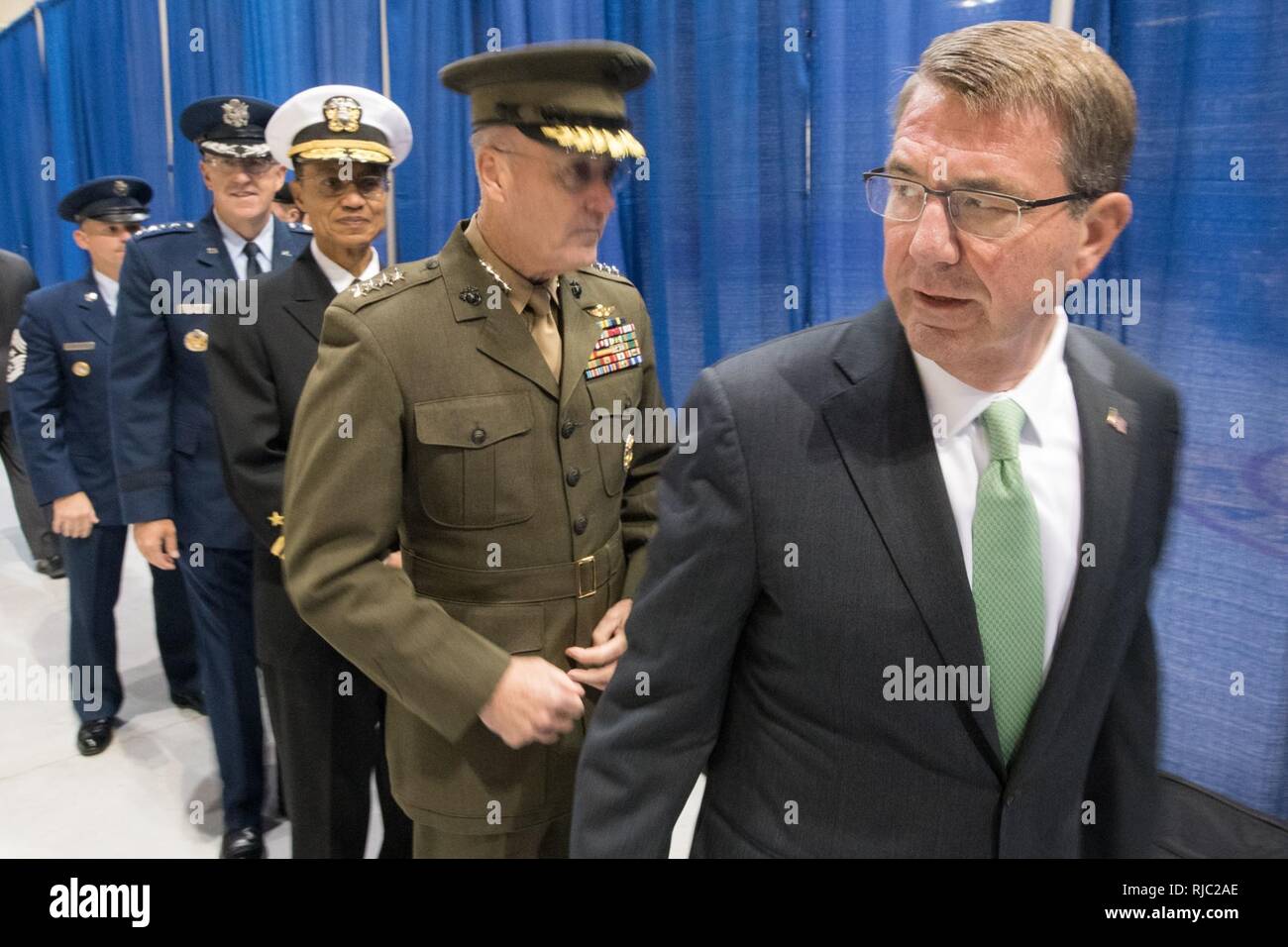 Defense Secretary Ash Carter, Marine Gen. Joseph F. Dunford Jr., chairman of the Joint Chiefs of Staff, Air Force Gen. John E. Hyten, and Navy Adm. Cecil D. Haney participate in the Strategic Command change of command ceremony at Offutt Air Force Base, Omaha, Nebraska Nov. 3, 2016.  Air Force Gen. John E. Hyten assumes command from Navy Adm. Cecil D. Haney. Stock Photo