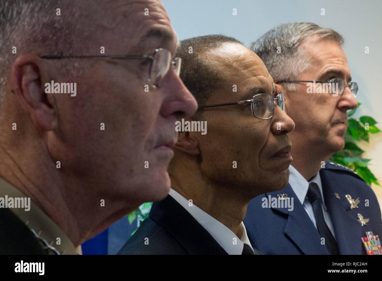 Defense Secretary Ash Carter, Marine Gen. Joseph F. Dunford Jr., chairman of the Joint Chiefs of Staff, Air Force Gen. John E. Hyten, and Navy Adm. Cecil D. Haney listen to a brief before the Strategic Command change of command ceremony at Offutt Air Force Base, Omaha, Nebraska Nov. 3, 2016.  Air Force Gen. John E. Hyten assumes command from Navy Adm. Cecil D. Haney. Stock Photo