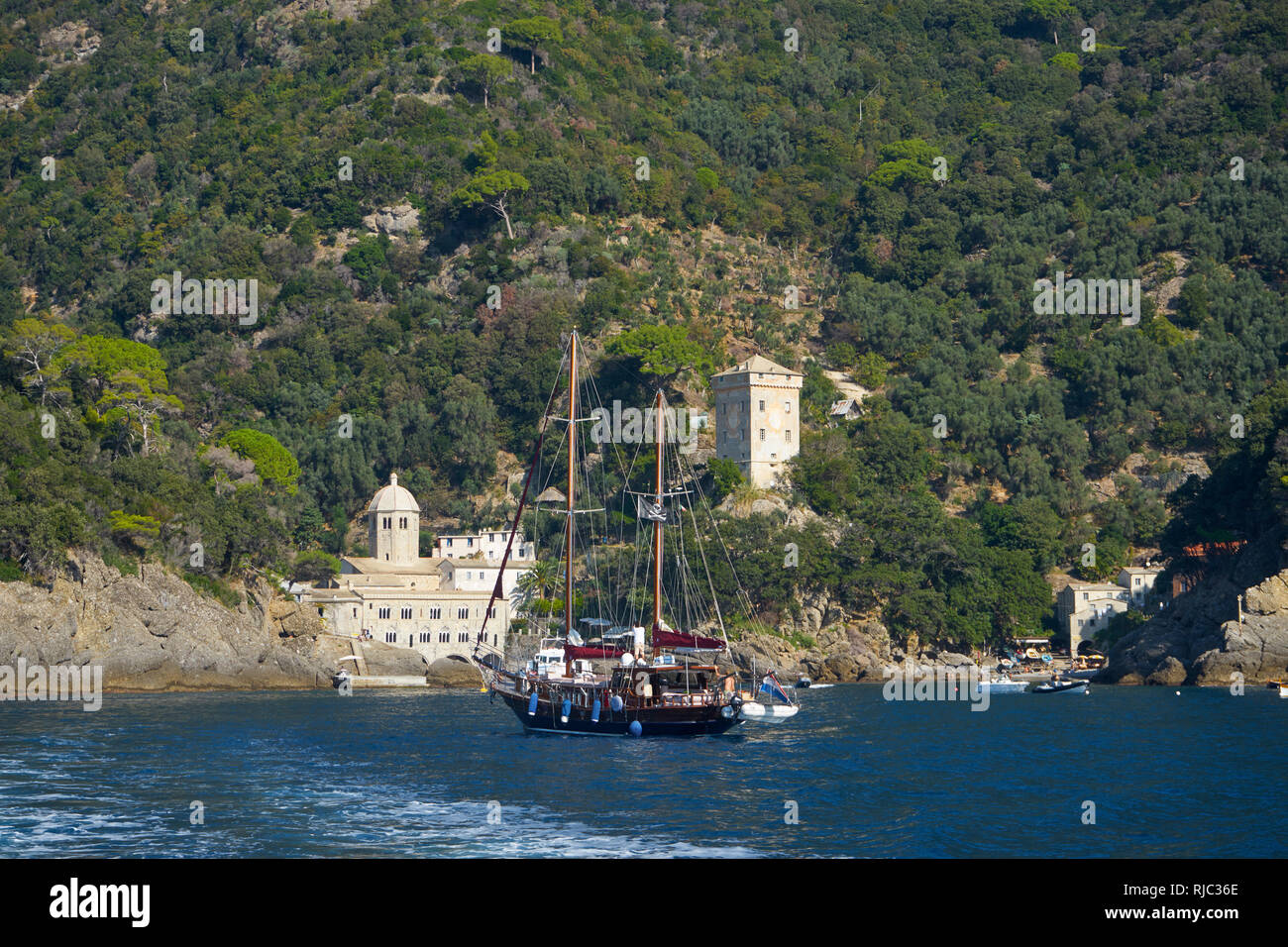 San Fruttuoso Monastery, Ligurian Coast, Italy: sail boat approaching Stock Photo