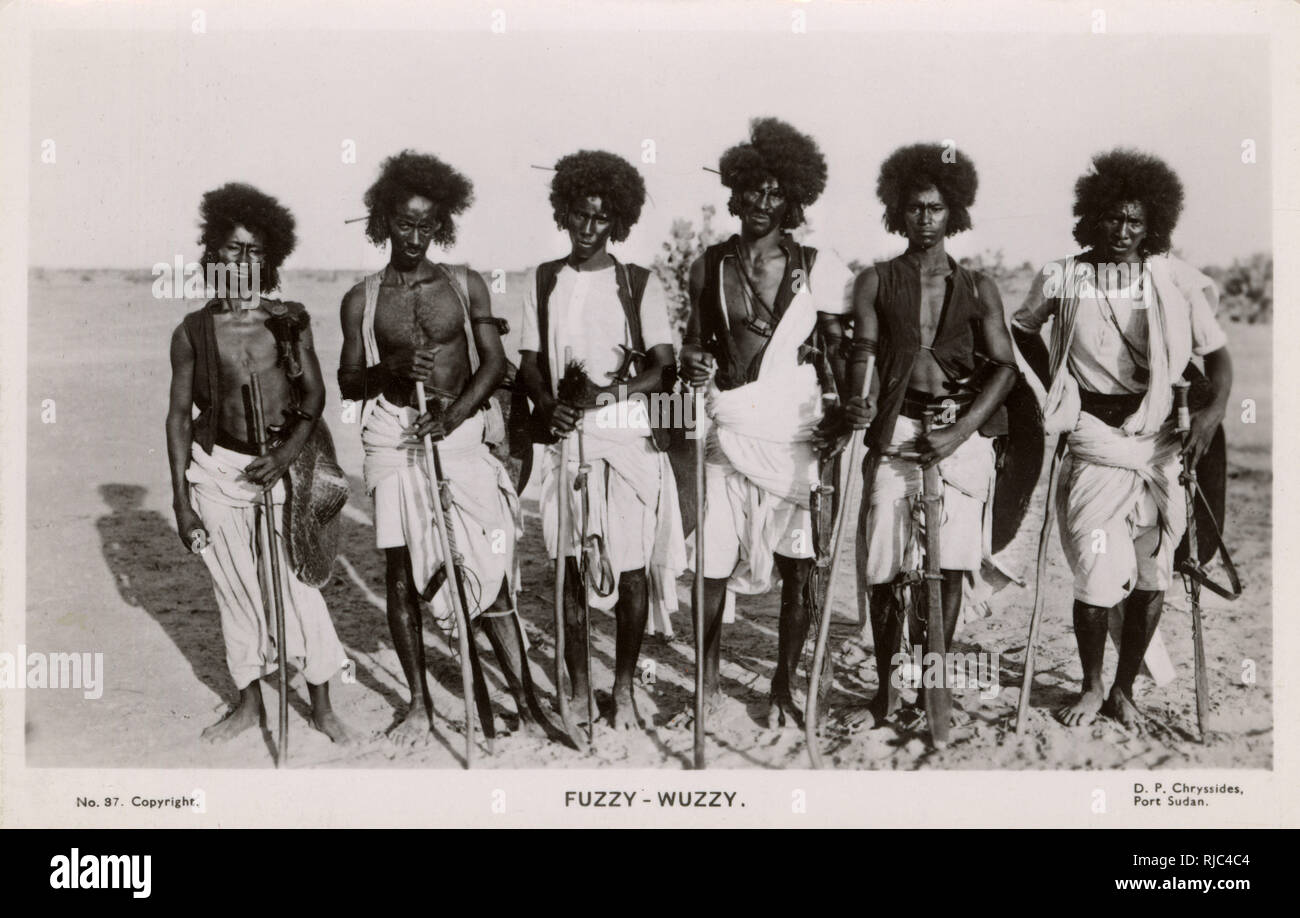 Sudan - A group of Hadendoa Warriors. The Hadendoa is the name of a nomadic subdivision of the Beja people, known for their support of the Mahdiyyah rebellion during the 1880s to 1890s. The area historically inhabited by the Hadendoa is today parts of Sudan, Egypt and Eritrea. Their elaborate hairdressing (pictured here) gained them the name of 'Fuzzy-wuzzies' among the British troops during the Mahdist War. Stock Photo