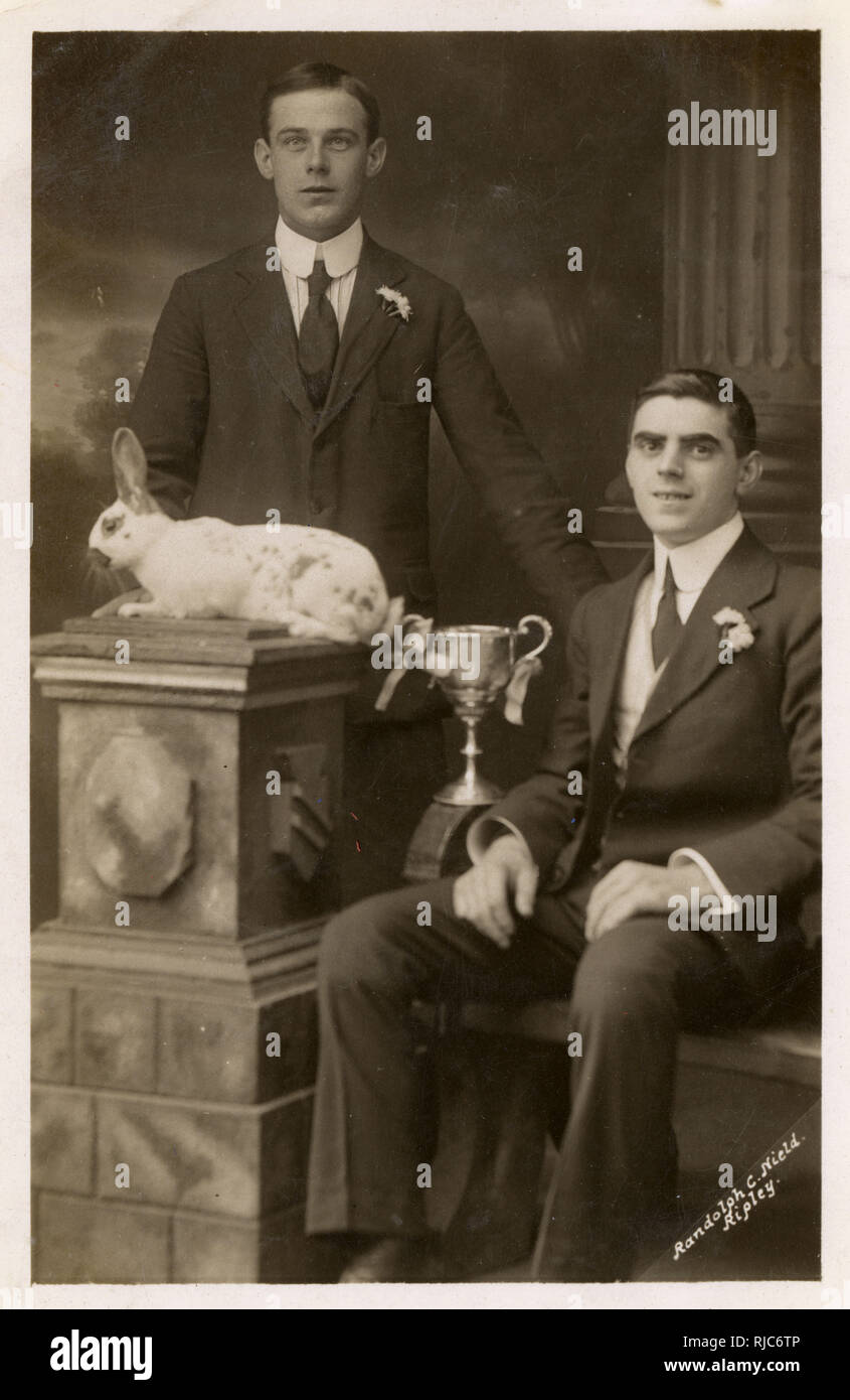 A Prize-winning rabbit and two proud owners (and cup! Stock Photo - Alamy