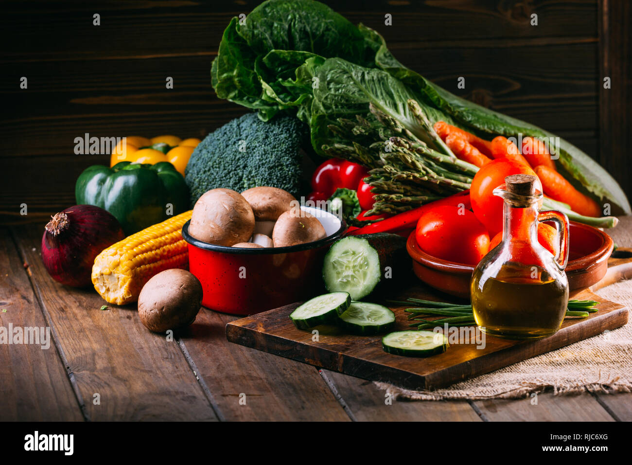 Vegetables and utensils on kitchen table Stock Photo