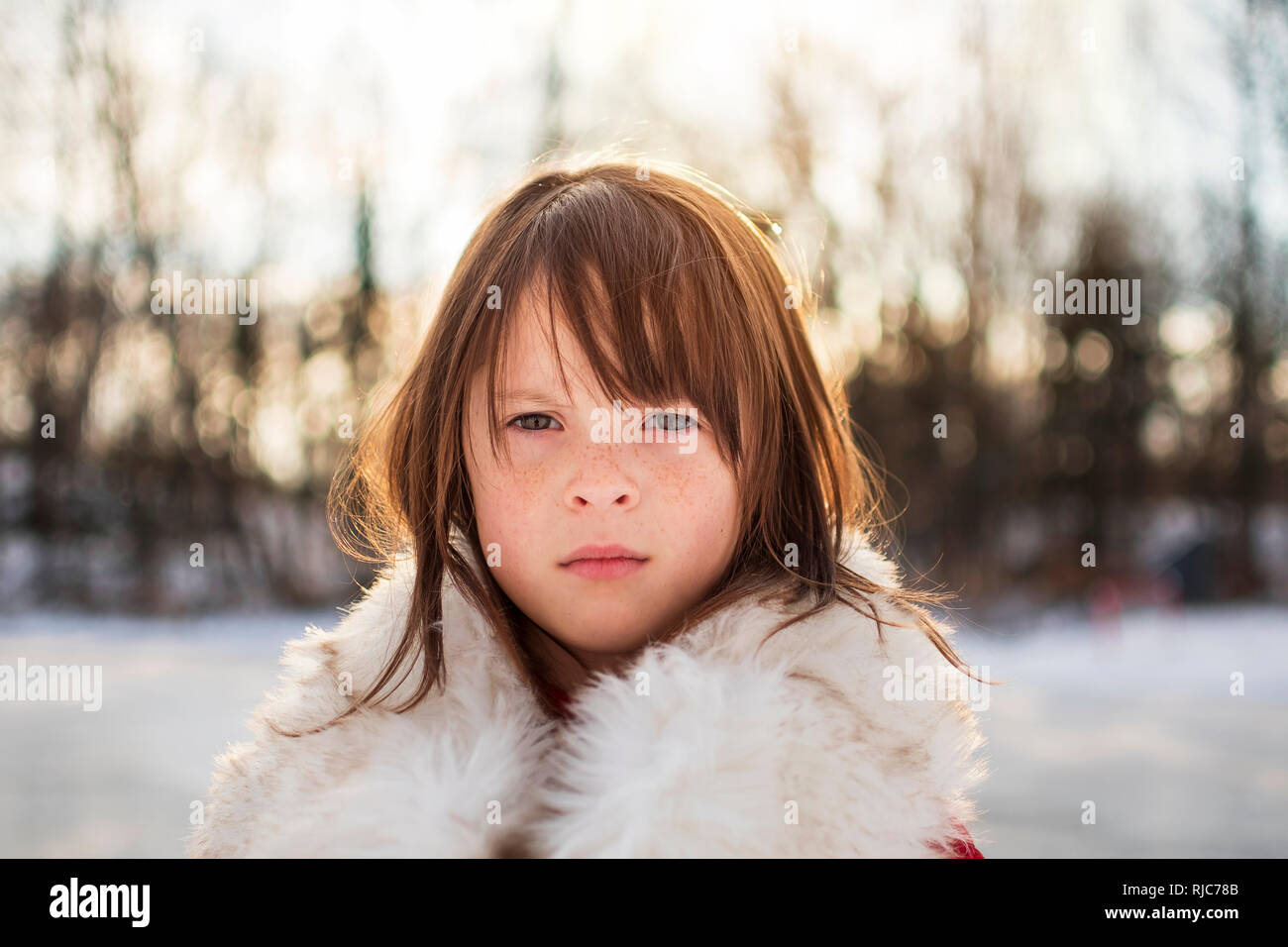 Portrait of a girl standing in snow, United States Stock Photo