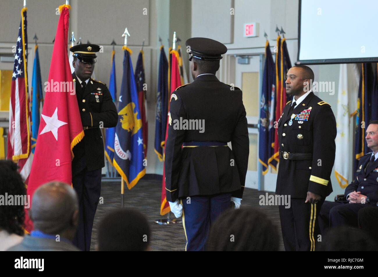 Brigadier General Reginald Neal, Director of the Joint Staff, Georgia National Guard, observes the unfurling of the general’s flag during his promotion ceremony at Clay National Guard Center. Stock Photo