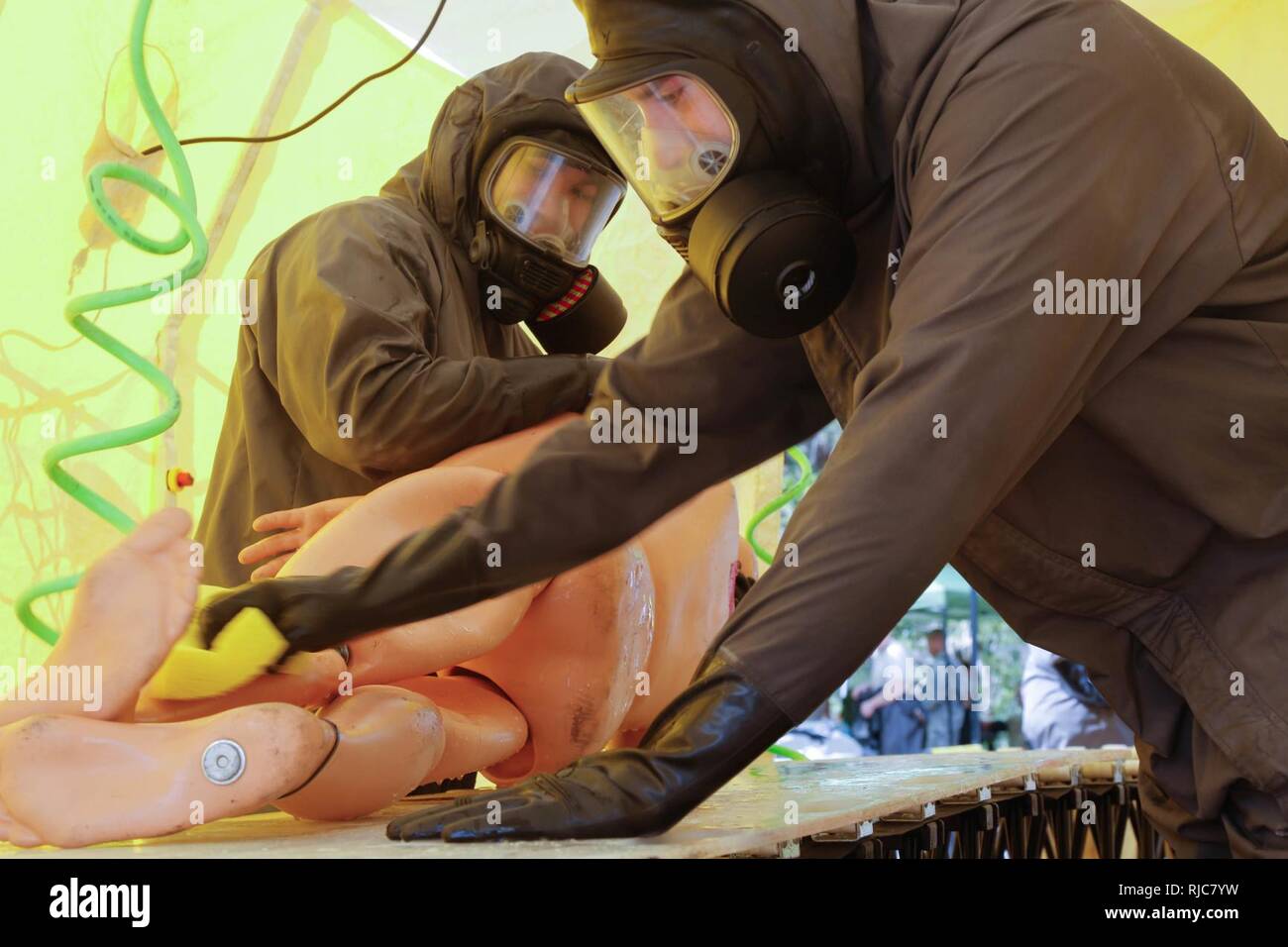U. S. Army Reserve Soldiers assigned to 468th engineer detachment decontaminates casualties in a Joint Training Exercise on Miami- Dade Fire Rescue Urban Search and Rescue Training Site in Miami, Fla. Jan. 09, 2018. This JTE focused on building response capabilities and seamless transition between the local first responders and the follow-on support provided by the National Guard and Active duty soldiers. (U. S. Army Stock Photo