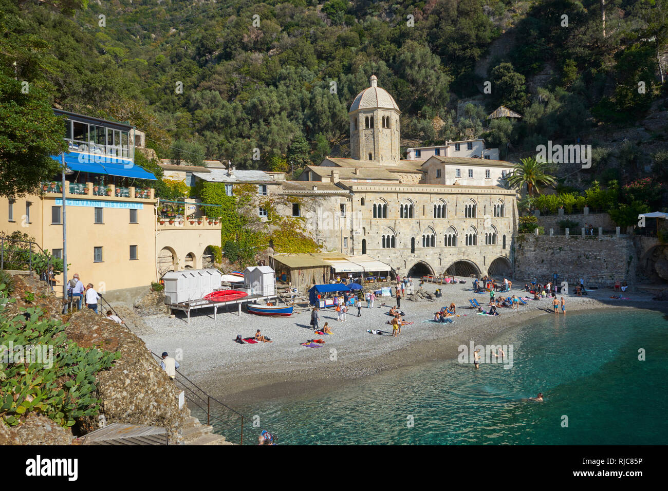 San Fruttuoso Monastery, Ligurian Coast, Italy: the beach with sunbathers Stock Photo