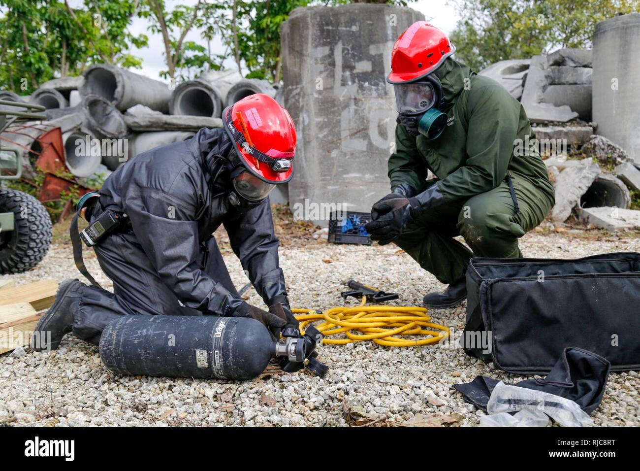 U. S. Army Reserve Soldiers assigned to 424th engineer Company prepares a compressed air tank in a Joint Training Exercise on the Miami-Dade Fire Rescue Urban Search and Rescue Training Site in Miami, Fla. Jan. 10, 2018. This JTE focused on building response capabilities and seamless transition between the local first responders and the follow-on support provided by the National Guard and Active duty soldiers. (U. S. Army Stock Photo