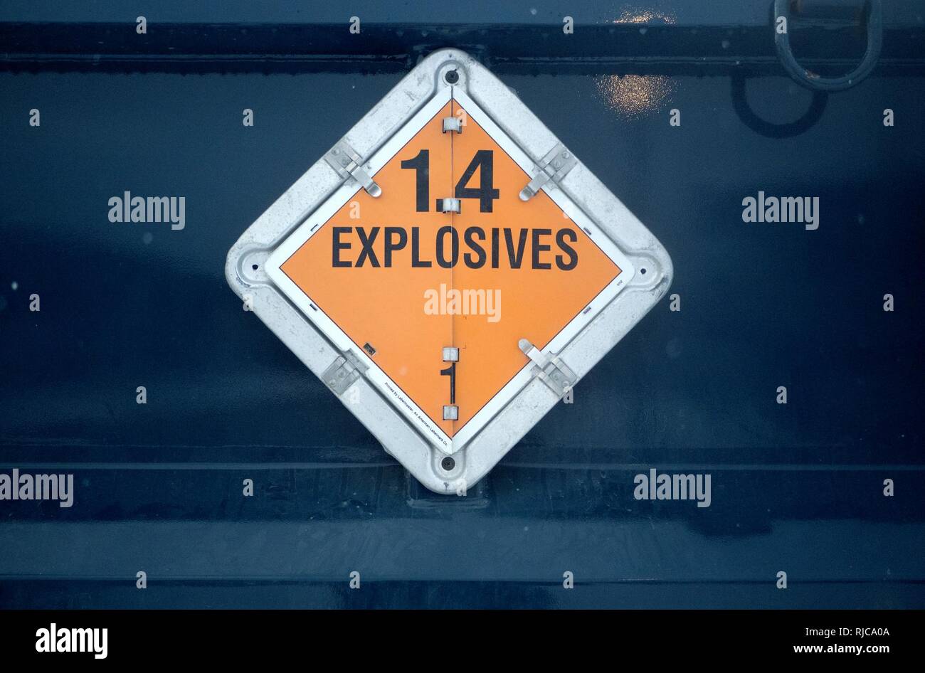 An explosives sign is seen on the side of a vehicle transporting ...