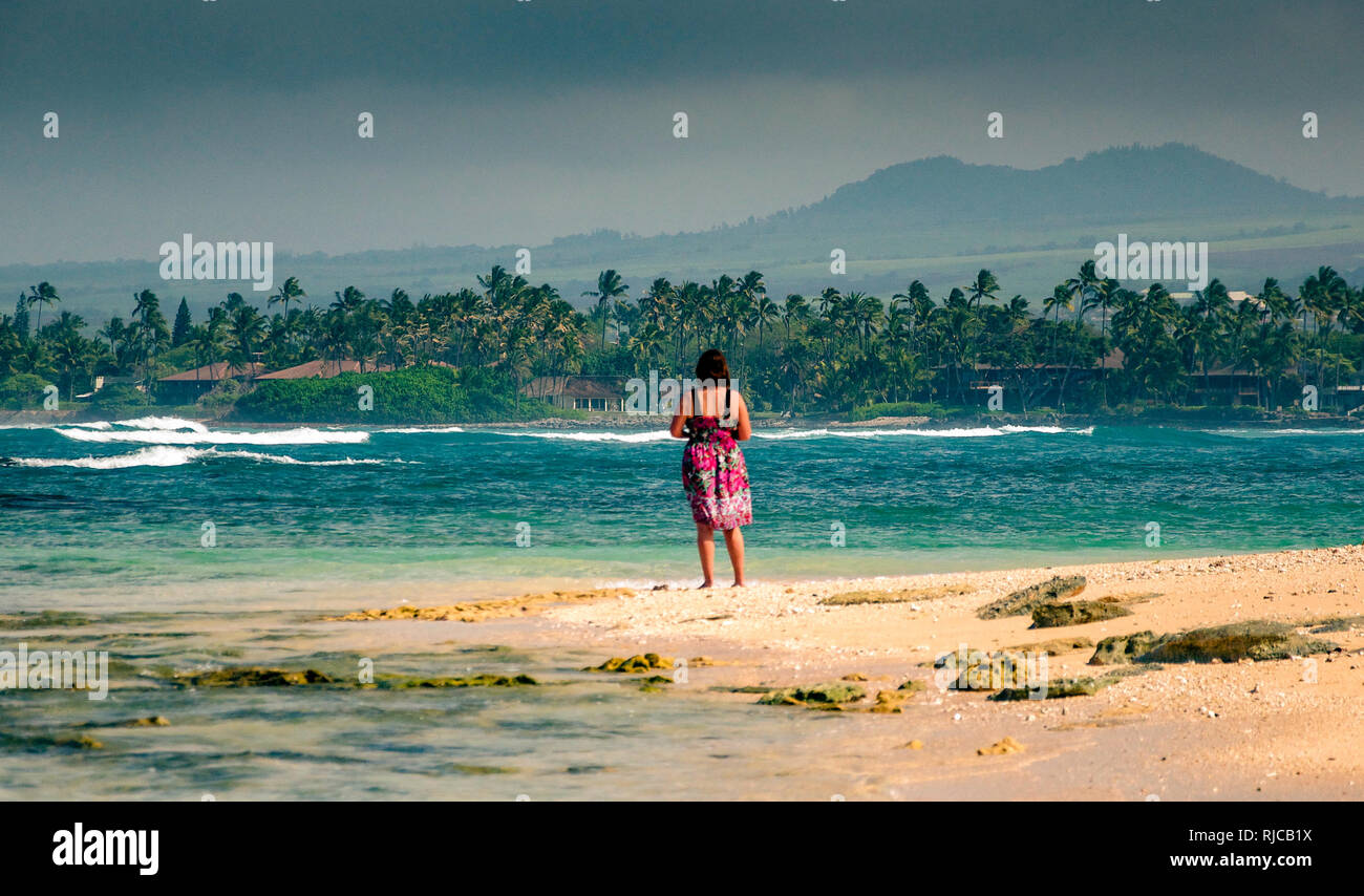 Woman standing on beach, Maui, Hawaii, Untied States Stock Photo