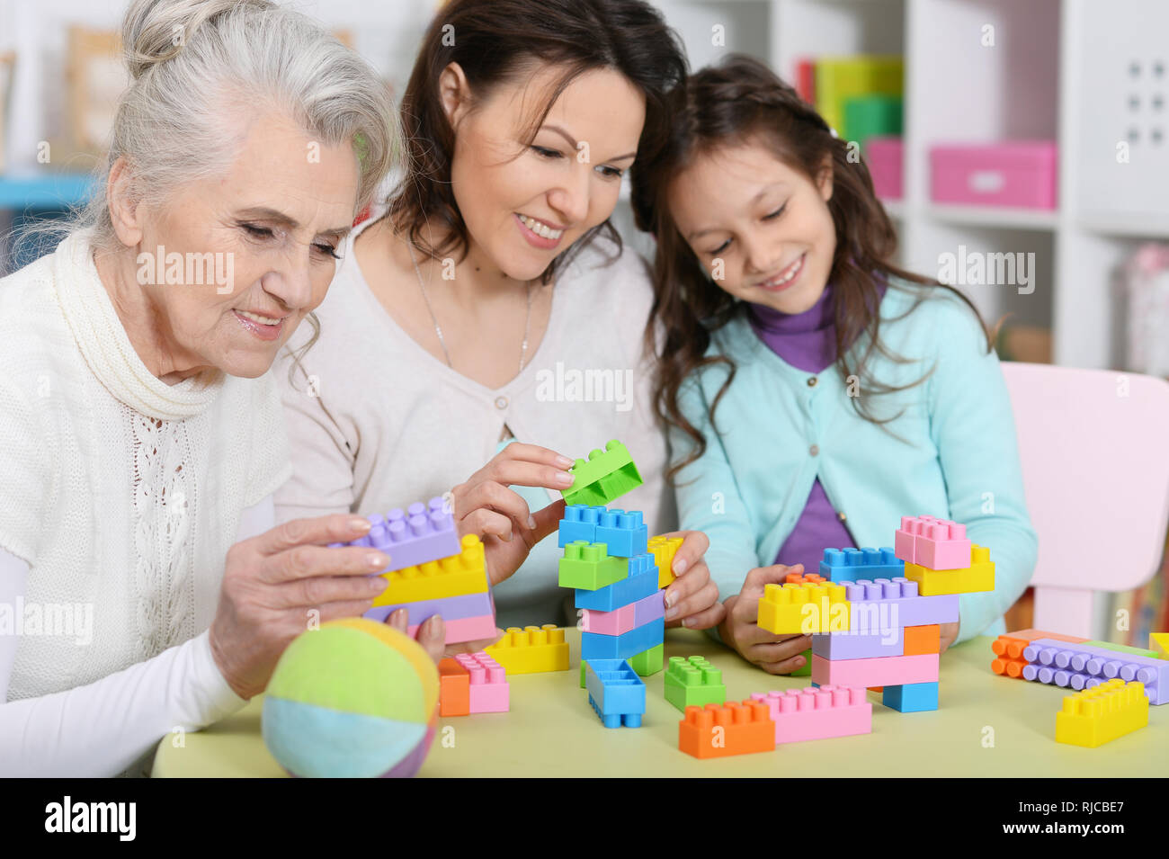 Portrait of girl with mother and grandmother Stock Photo - Alamy