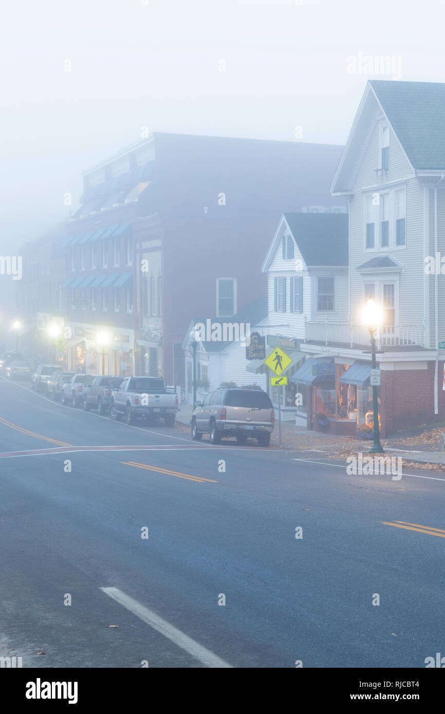 Main Street (Route 1) in downtown Camden, Maine USA on a foggy autumn morning. The town of Camden is located on the coast of Maine. Stock Photo
