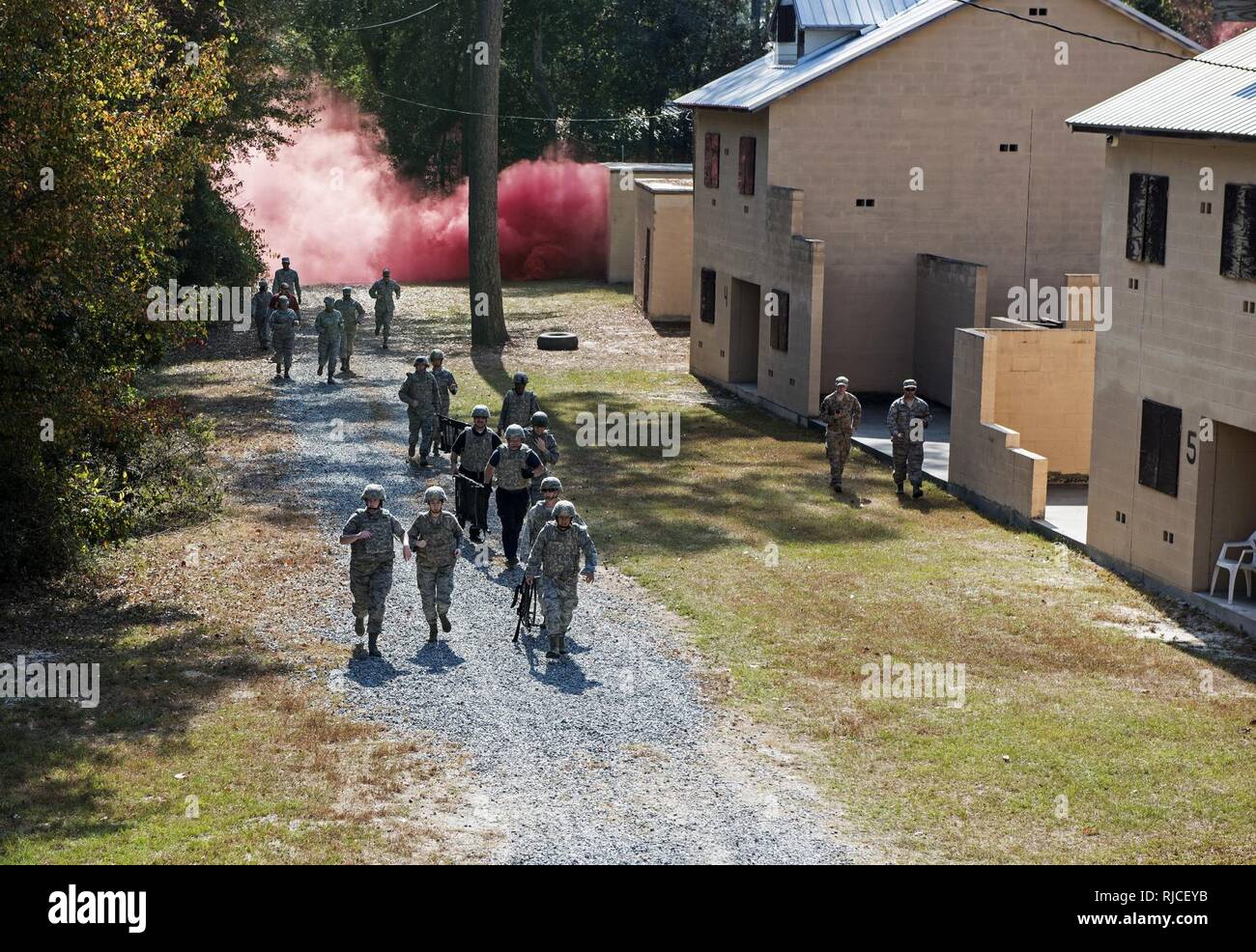 A team of medics respond to a simulated attack during an Emergency Medical Technician refresher course, Nov. 4, 2016, at Moody Air Force Base, Ga. The medics utilized the Military Operations in Urban Terrain village where they were tested on skills they’d spent the week refreshing. Stock Photo