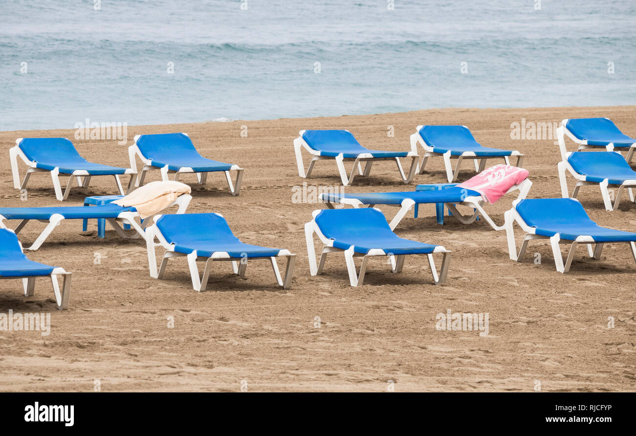 Towels on beach sunloungers in Spain Stock Photo