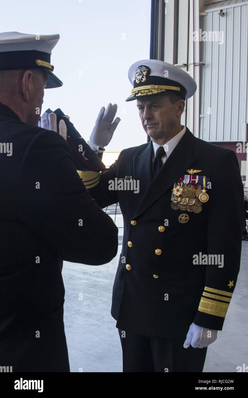 SAN DIEGO (January 11, 2018) Vice Adm. Mike Shoemaker salutes the U.S. flag during a Commander, Naval Air Forces change of command and retirement ceremony at Naval Air Station North Island. Shoemaker was relieved by Vice Adm. DeWolfe Miller III as commander of Naval Air Forces. Stock Photo