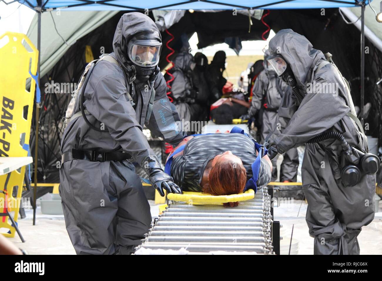 Soldiers assigned to the 409th Area Support Medical Company, Madison, Wisconsin transport simulated casualties during a Joint Training Exercise hosted by the Homestead-Miami Speedway and Miami-Dade Fire Department in Miami, Florida. Jan. 11, 2018. This JTE focused on building response capabilities and the seamless transition between the local first responders and the follow-on support provided by the National Guard and Active duty soldiers. (U. S. Army Stock Photo