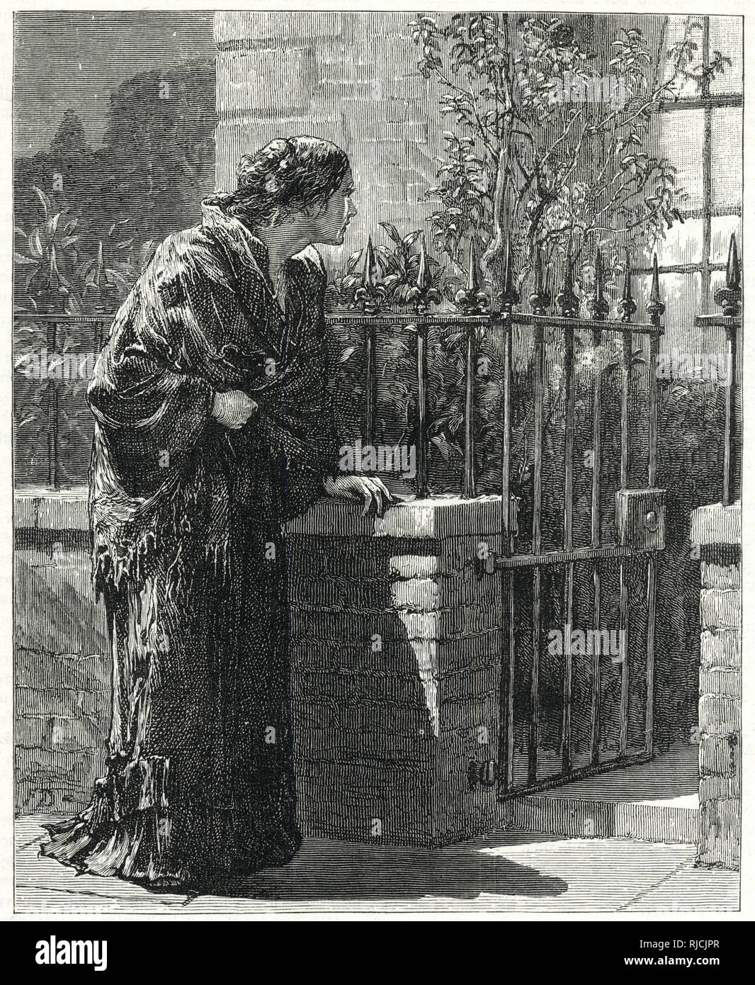 Outcast woman outside a house. Stock Photo