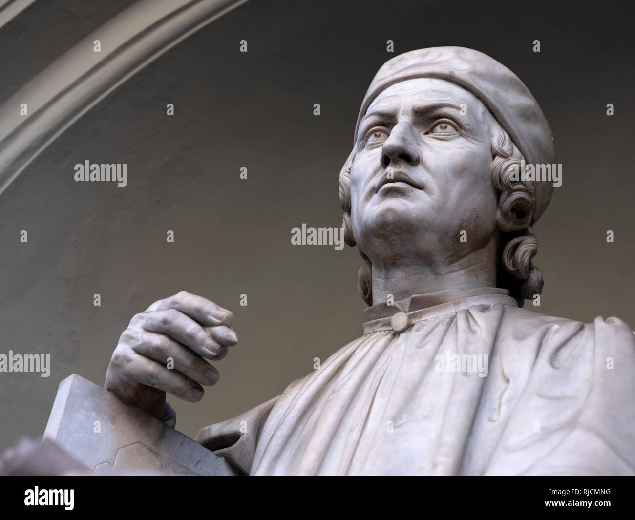 Statue of Arnolfo di Cambio Looking up at the Duomo Florence Cathedral Stock Photo