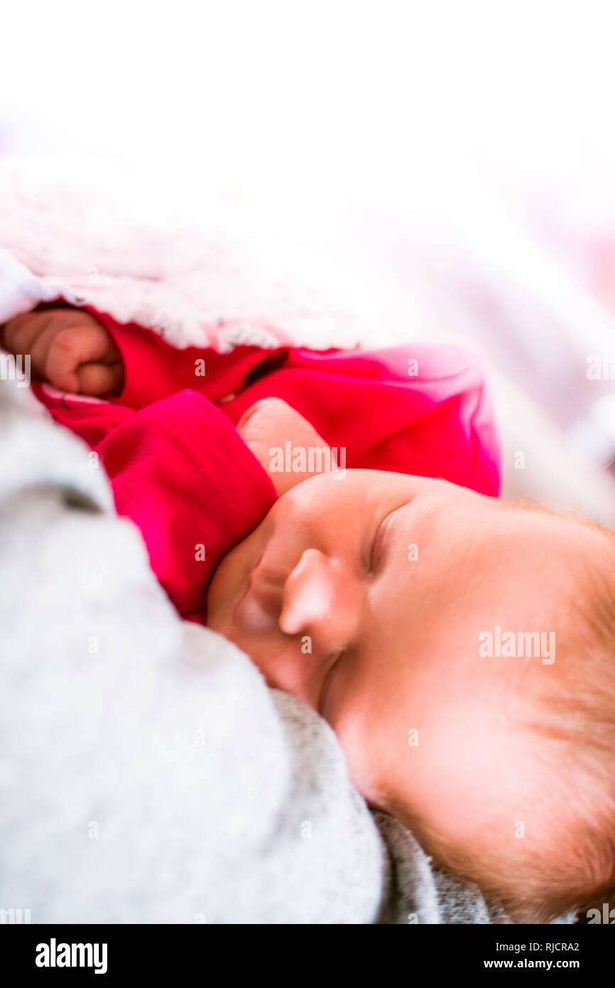 Baby sleeping. new born baby. infant asleep in cot wrapped in blanket. Stock Photo