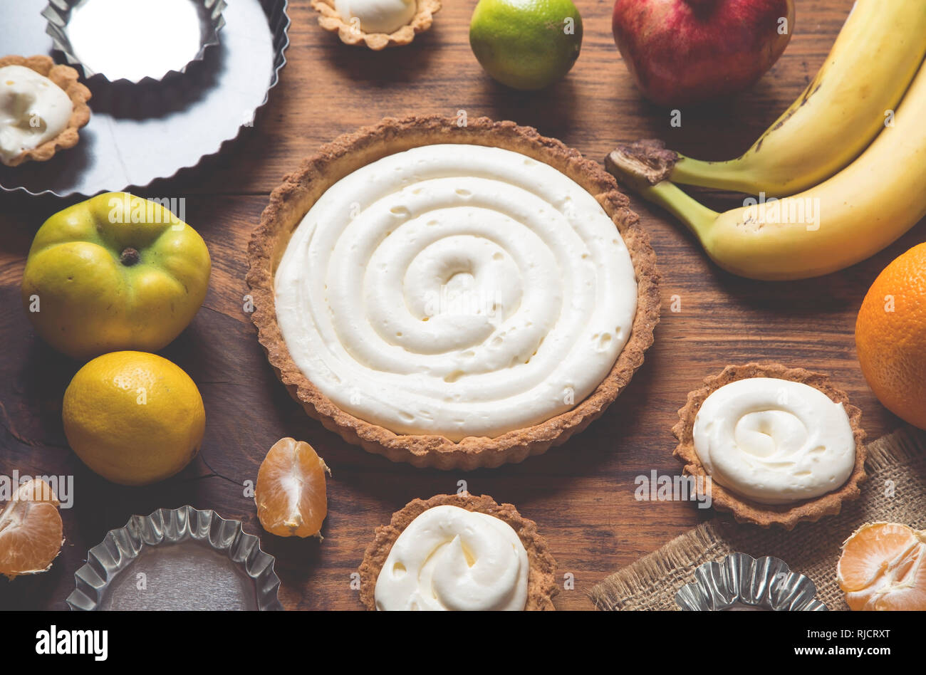 Preparing a fruit cake on rustic wooden table Stock Photo