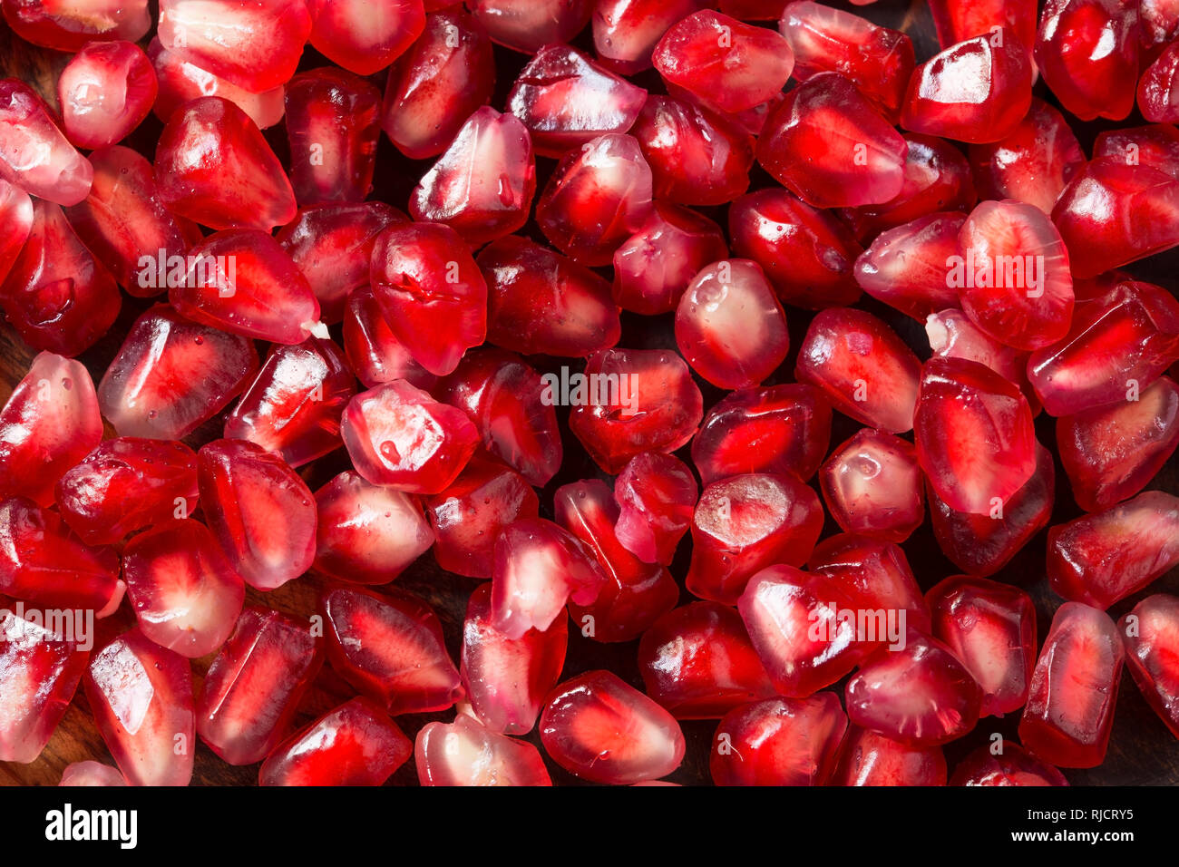 Fresh pomegranate on wooden background Stock Photo