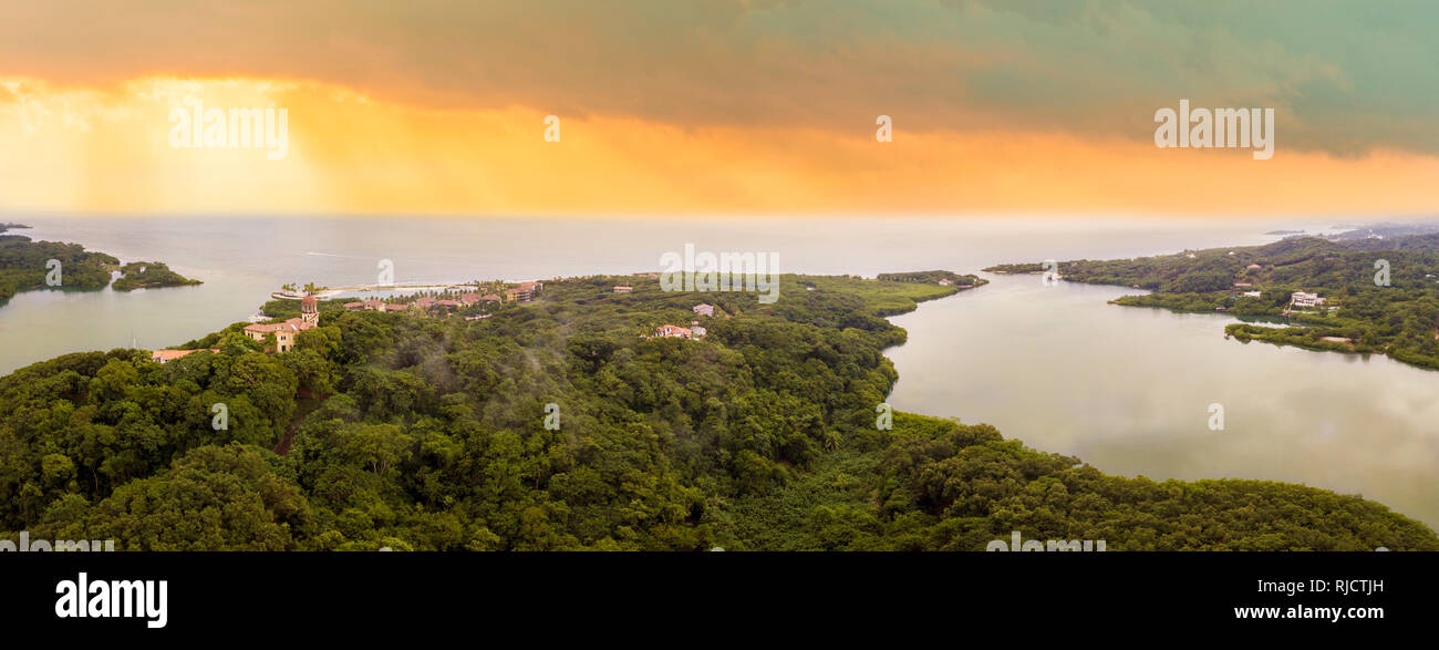 Aerial 180 degree panorama of the south shore of Roatan at sunrise. Stock Photo