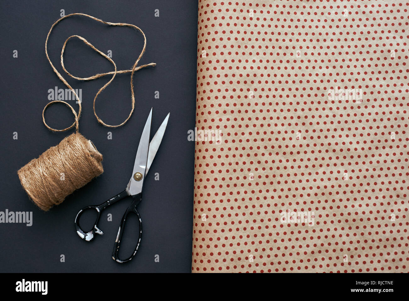 Make your own gift box design with wrapping paper, ribbon and scissors Stock Photo