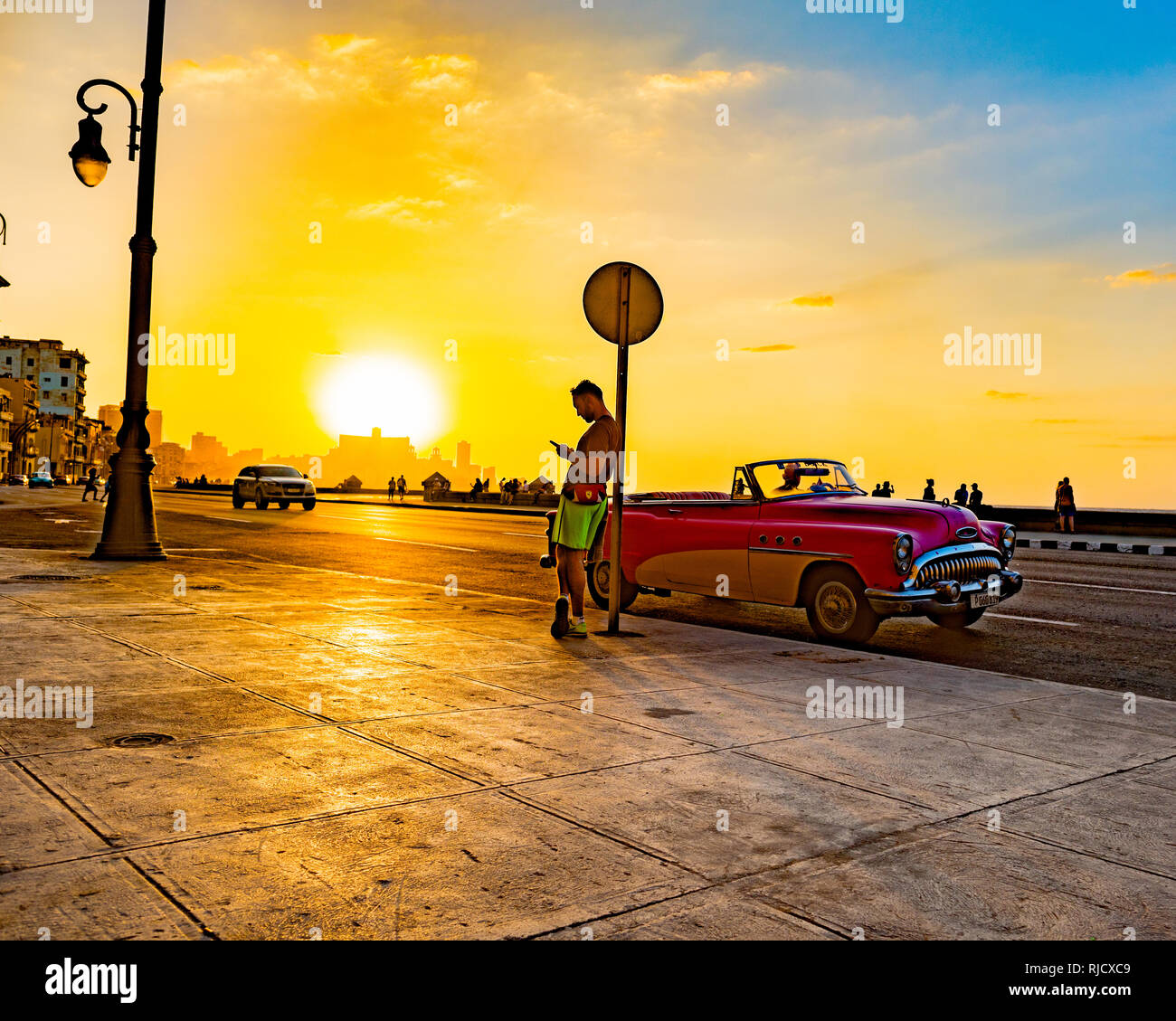 Waiting in the Cuban Sun, Malécon, Havana. Stock Photo