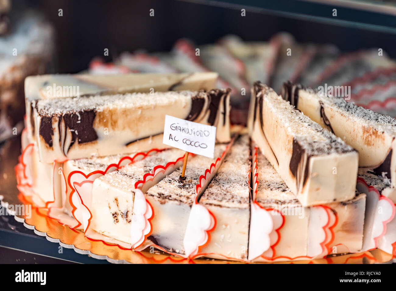 Closeup of chocolate coconut cream cheese cheesecakes swirl slices