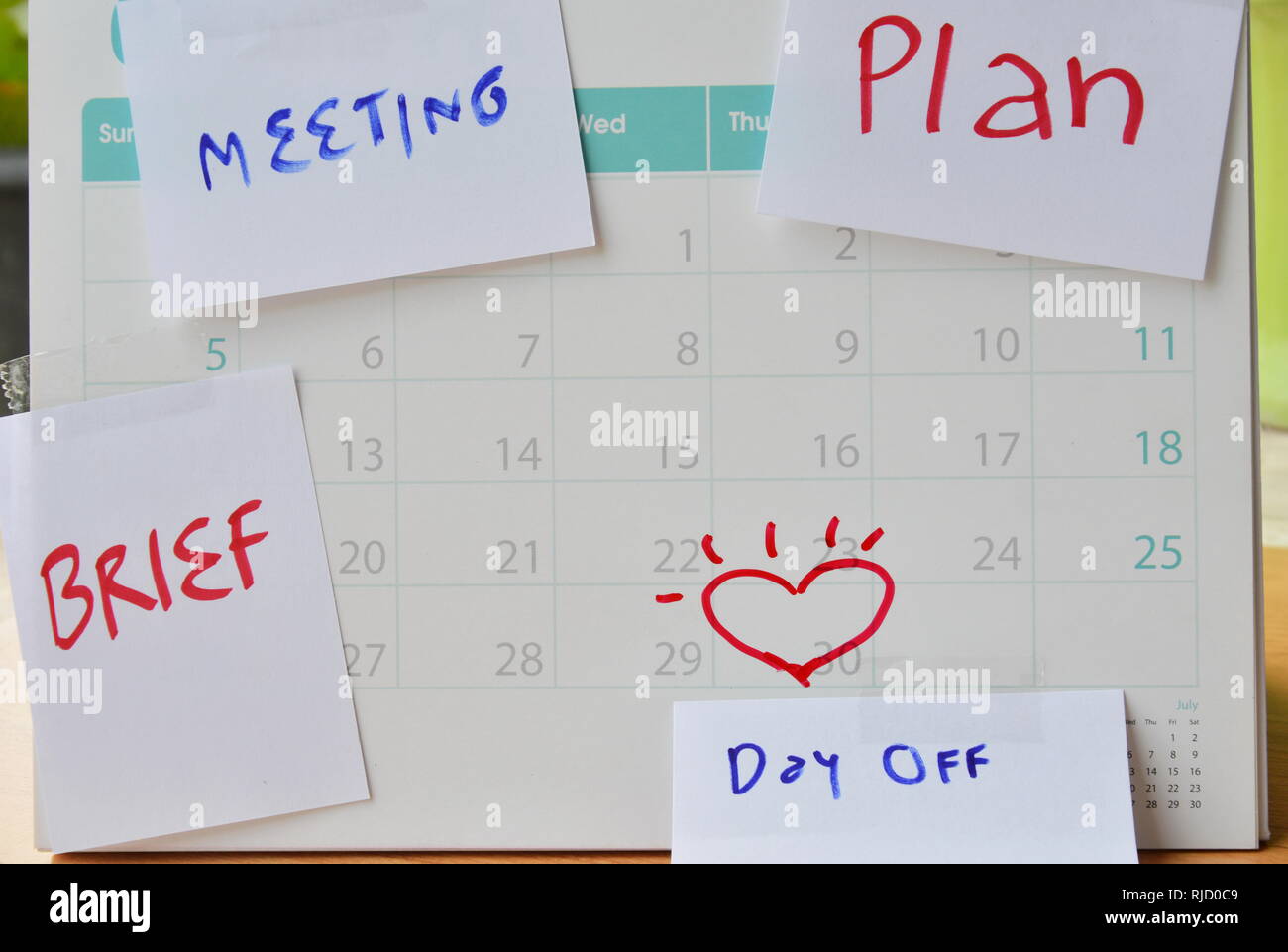 paper note for vacation remind stick on calendar Stock Photo