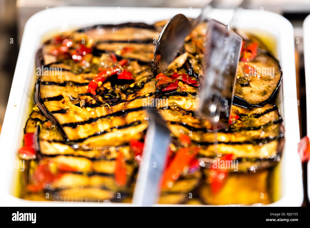 Marinated grilled eggplant slices vegetable in olive oil and pepper